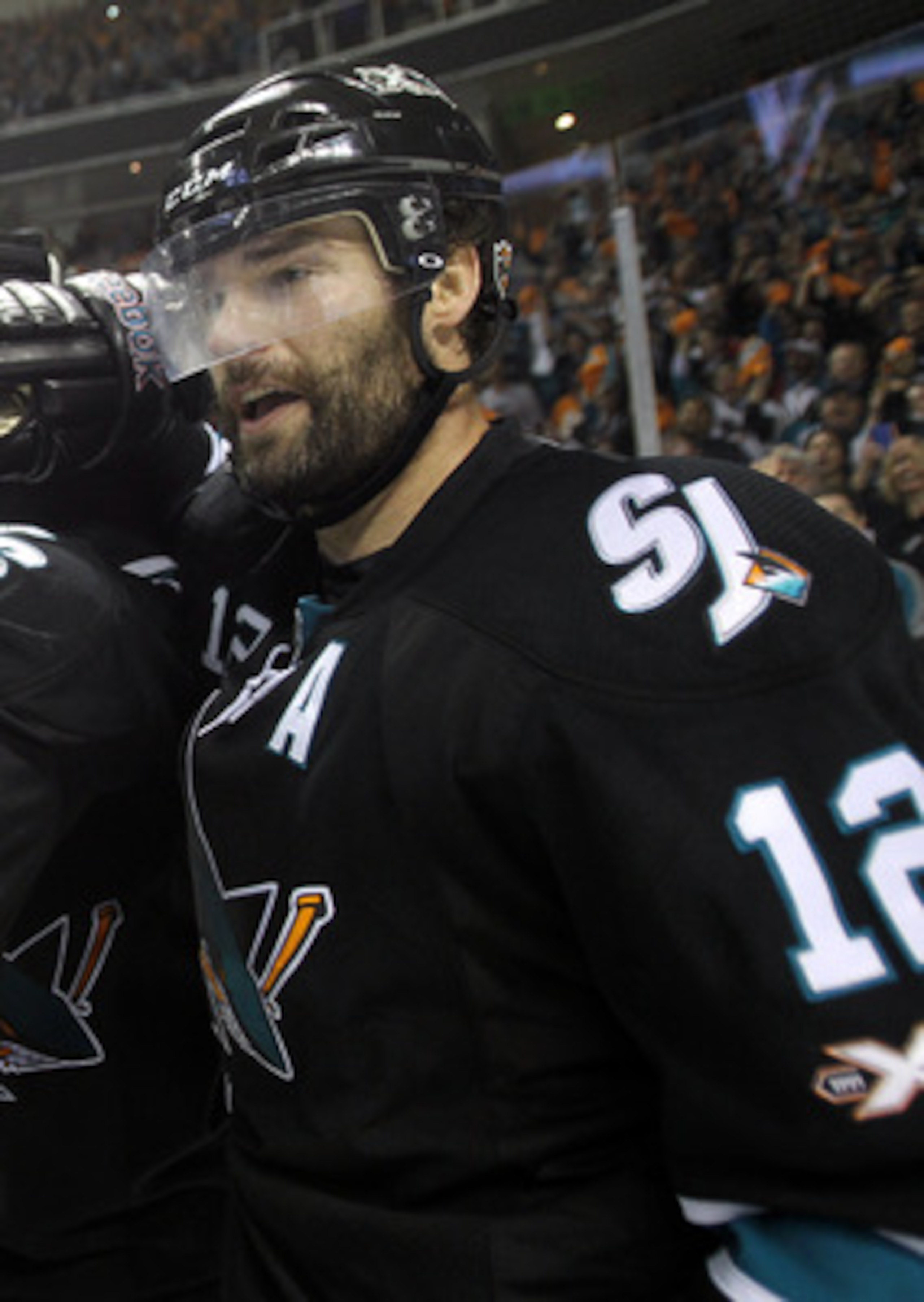 SAN JOSE, CA - MAY 12:  Joe Pavelski #8 and Patrick Marleau #12 congratulate Antti Niemi #31 of the San Jose Sharks after thye beat the Detroit Red Wings in Game Seven of the Western Conference Semifinals during the 2011 NHL Stanley Cup Playoffs at HP Pav