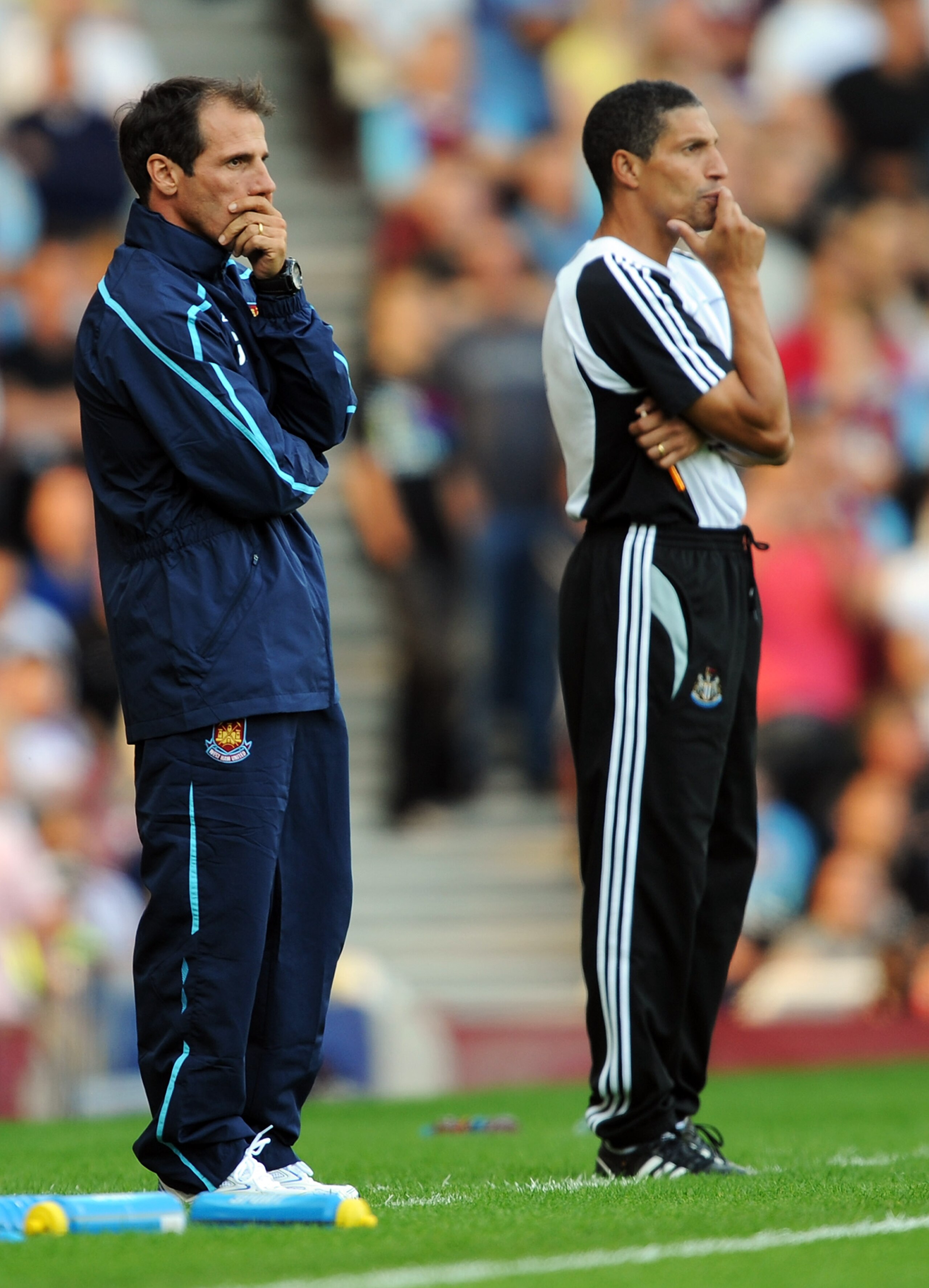 LONDON - SEPTEMBER 20:  West Ham Manager Gianfranco Zola (L) and Newcastle caretaker manager Chris Hughton look on during the Barclays Premier League match between West Ham United and Newcastle United at Upton Park on September 20, 2008 in London, England