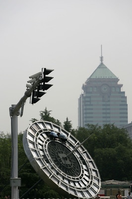 BEIJING, CHINA - JULY 13: (CHINA OUT) Workers install an Olympic parterre featuring a compass at a road on July 13, 2008 in Beijing, China. Beijing is making its final preparations for the Olympic Games, less than a month ahead of the big event. Over 1 mi