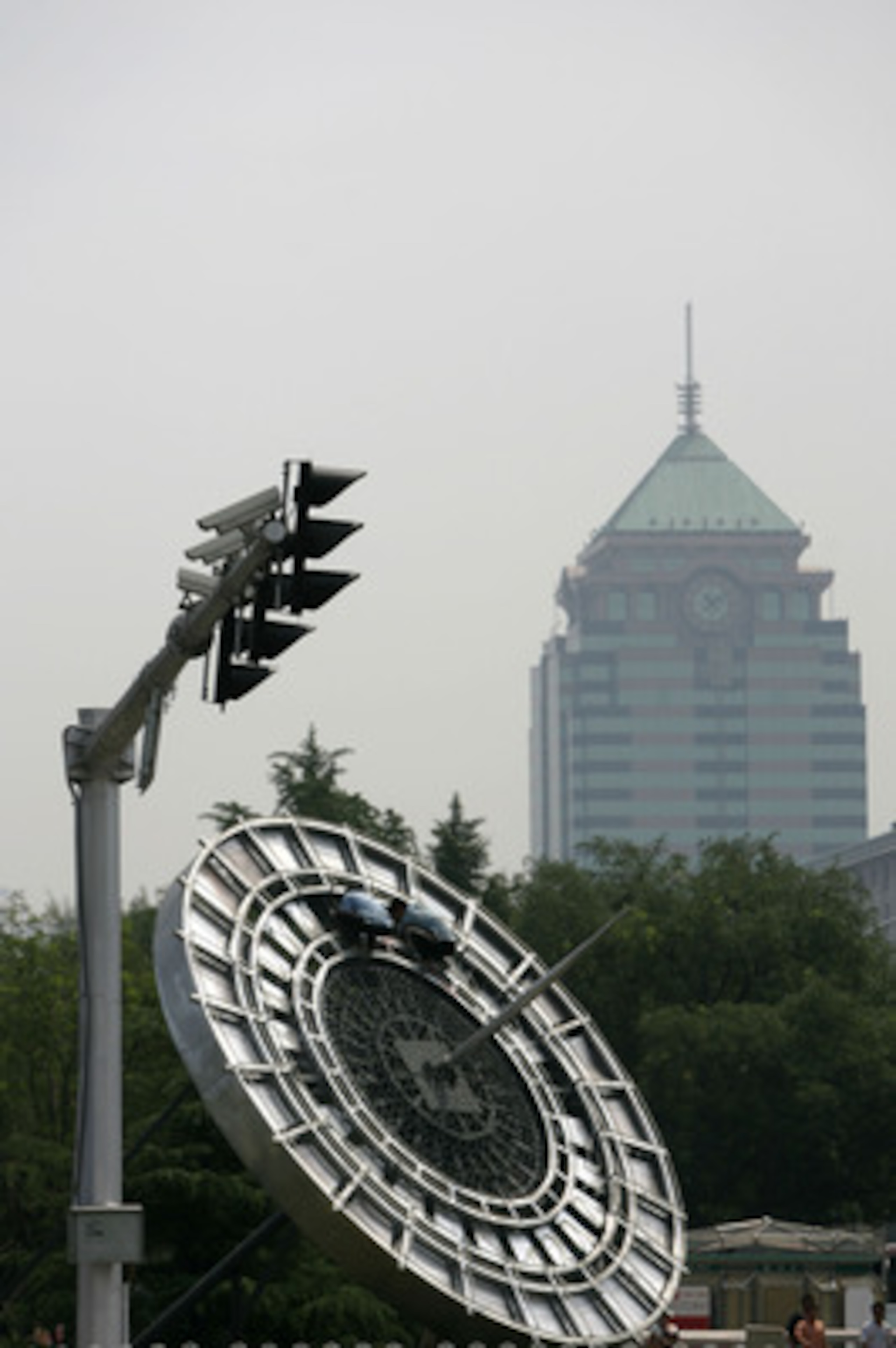 BEIJING, CHINA - JULY 13: (CHINA OUT) Workers install an Olympic parterre featuring a compass at a road on July 13, 2008 in Beijing, China. Beijing is making its final preparations for the Olympic Games, less than a month ahead of the big event. Over 1 mi