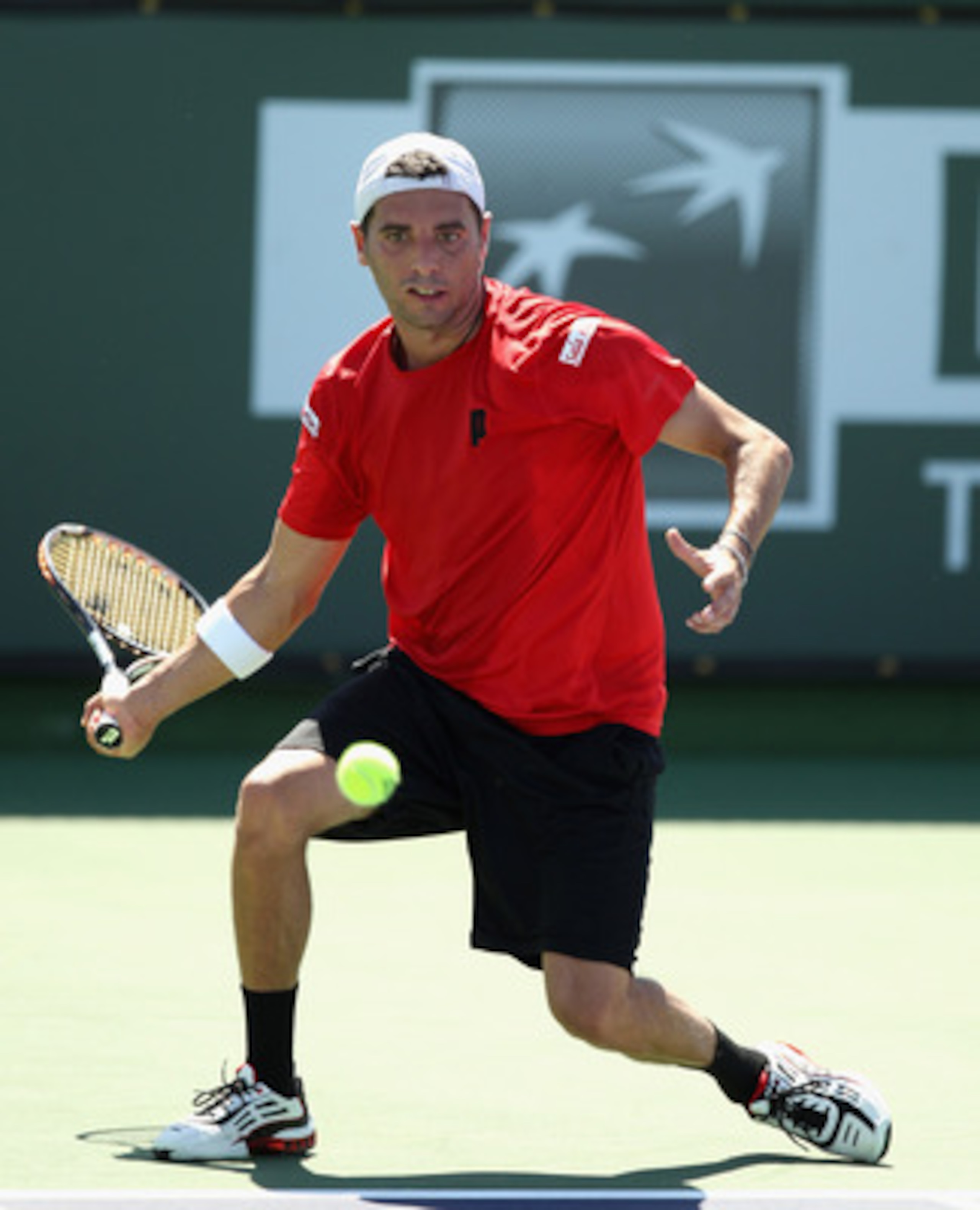 INDIAN WELLS, CA - MARCH 12:  Albert Montanes of Spain in action against Jarkko Nieminen of Finland during the BNP Paribas Open at the Indian Wells Tennis Garden on March 12, 2011 in Indian Wells, California.  (Photo by Ezra Shaw/Getty Images)