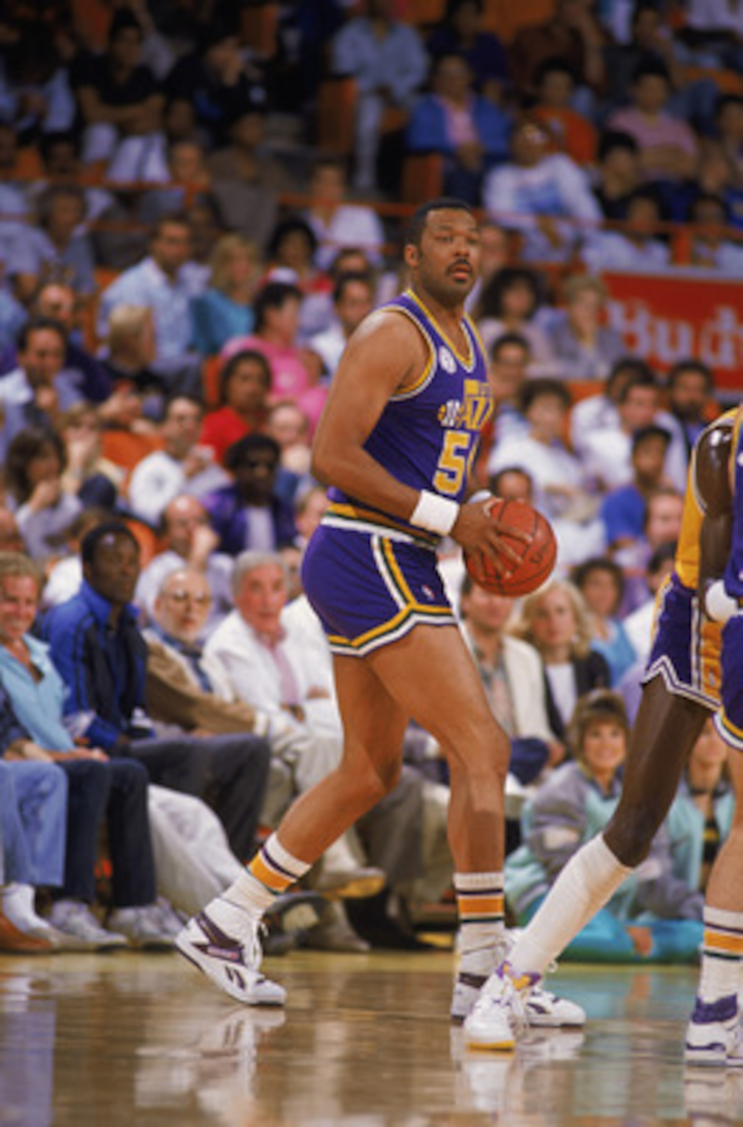 SALT LAKE CITY - 1988:  Mel Turpin #54 of the Utah Jazz dribbles the ball during an NBA game at The Salt Palace in Salt Lake City, Utah in 1988. (Photo by Stephen Dunn/Getty Images)