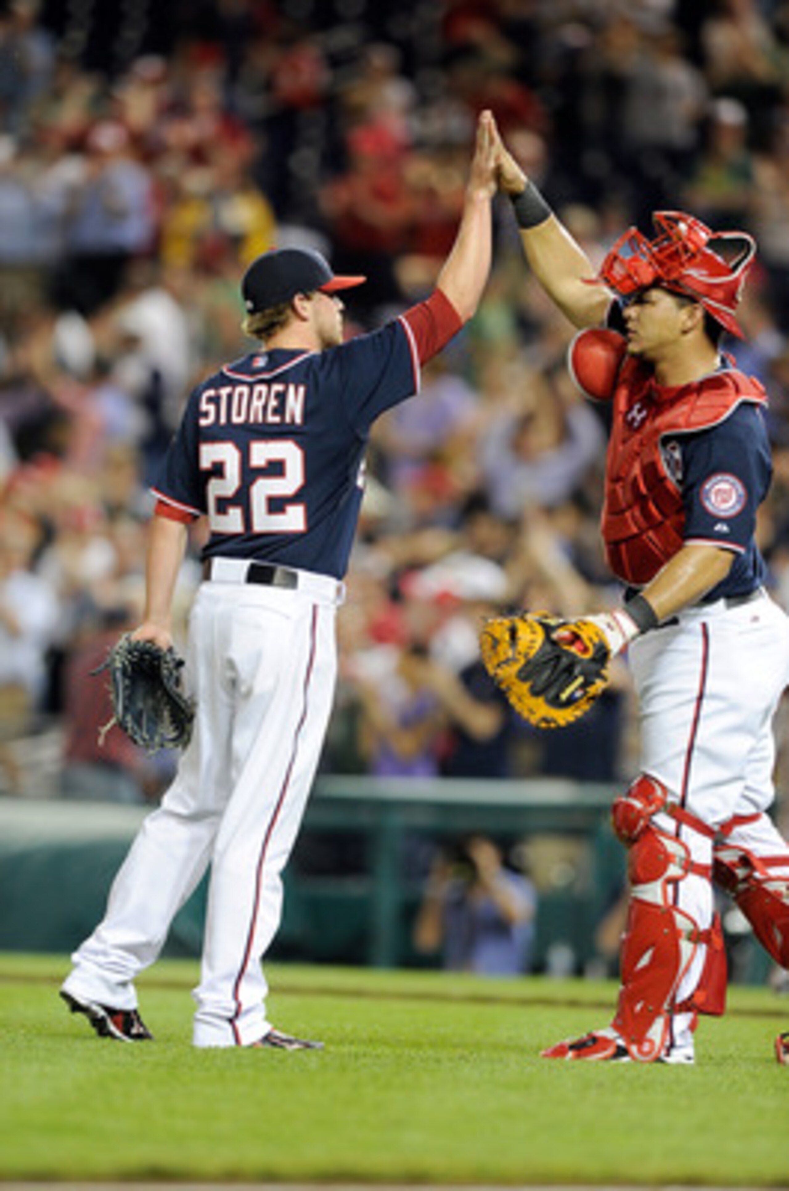 WASHINGTON, DC - MAY 02:  Drew Storen #22 of the Washington Nationals celebrates with Wilson Ramos #3 after a 2-0 victory against the San Francisco Giants at Nationals Park on May 2, 2011 in Washington, DC.  (Photo by Greg Fiume/Getty Images)