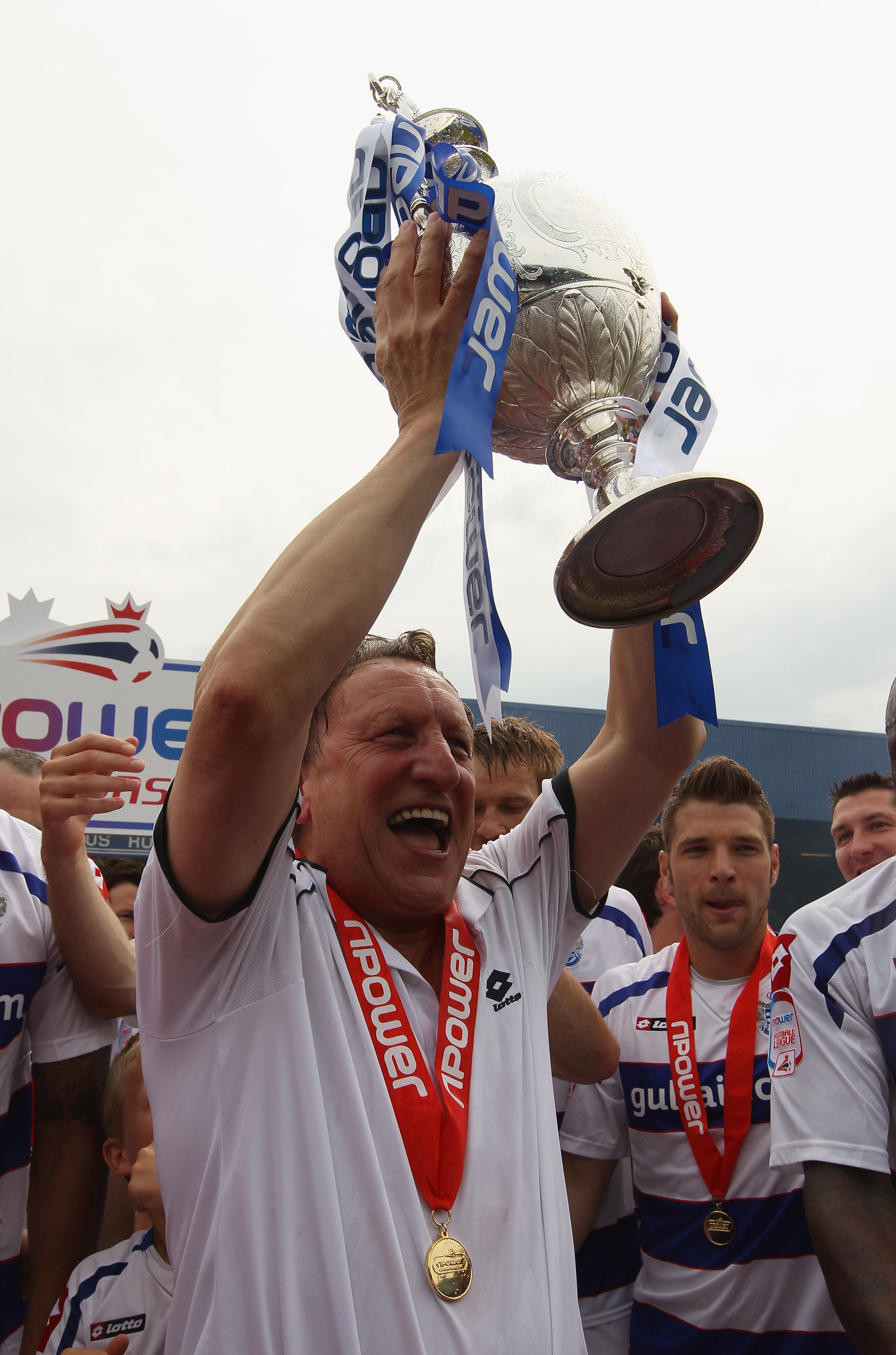 LONDON, ENGLAND - MAY 07:  QPR manager Neil Warnock celebrates with the trophy after winning the npower Championship match between Queens Park Rangers and Leeds United at Loftus Road on May 7, 2011 in London, England.  (Photo by Ian Walton/Getty Images)