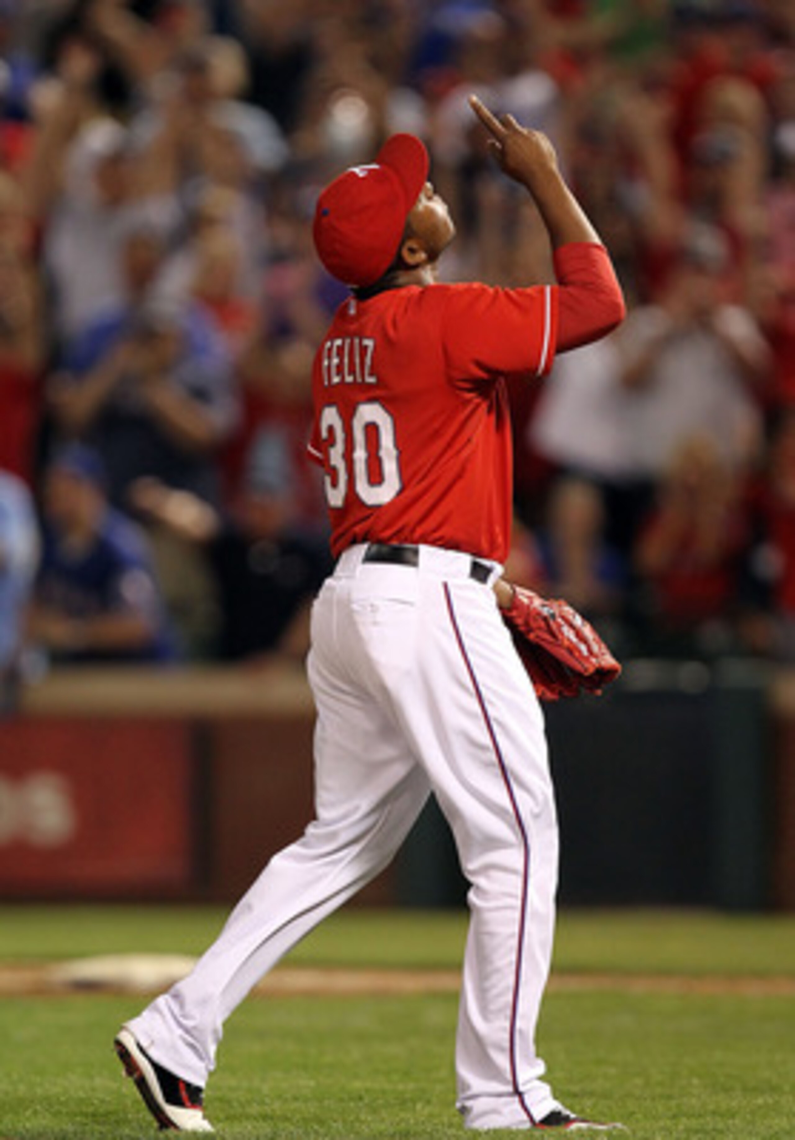 ARLINGTON, TX - MAY 07:  Pitcher Neftali Feliz #30 of the Texas Rangers reacts after a 7-5 win against the New York Yankees at Rangers Ballpark in Arlington on May 7, 2011 in Arlington, Texas.  (Photo by Ronald Martinez/Getty Images)