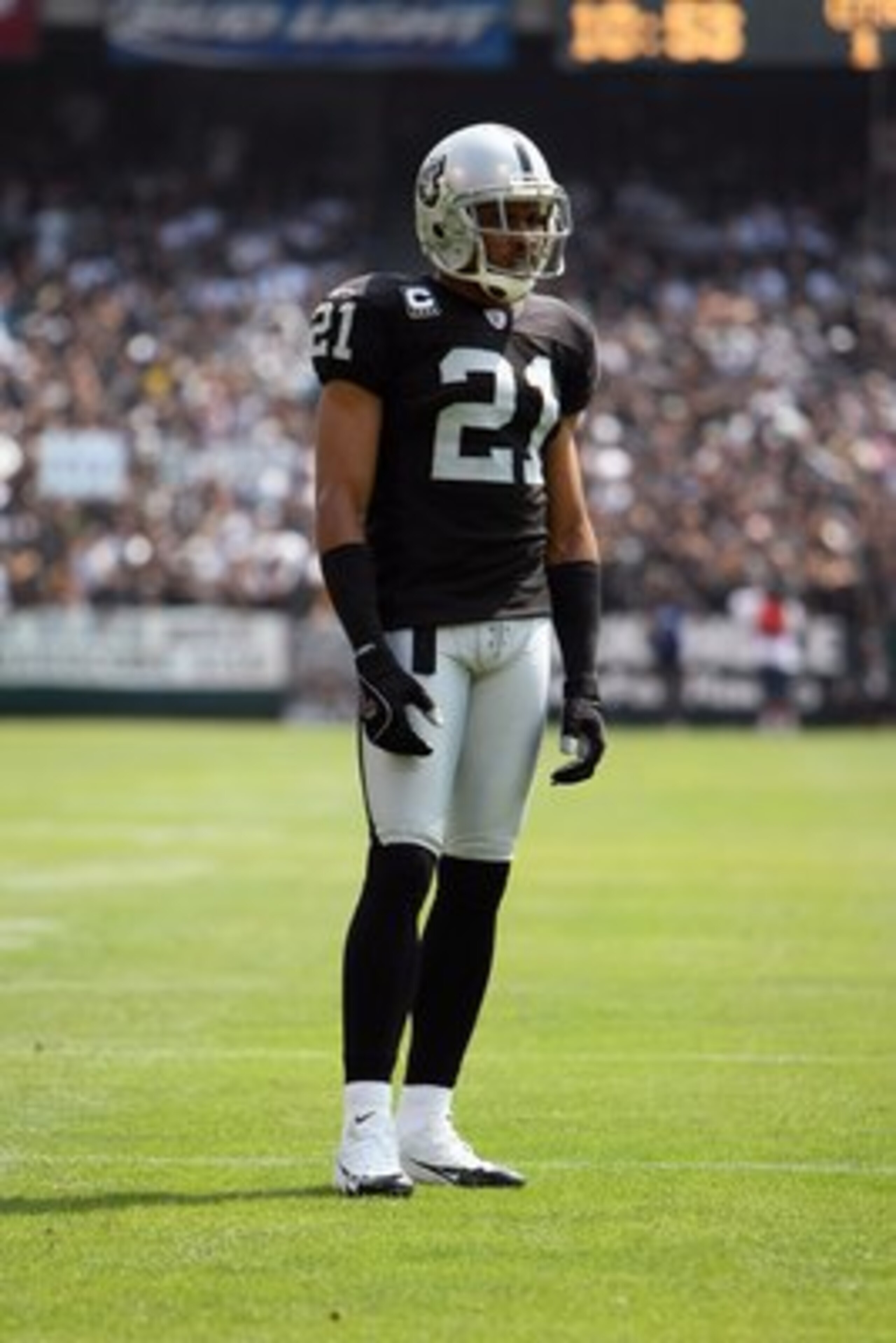 OAKLAND, CA - SEPTEMBER 09:  Nnamdi Asomugha #21 of the Oakland Raiders stands on the field against the Detroit Lions during an NFL game on September 9, 2007 at McAfee Coliseum in Oakland, California. Stanford Routt;George Foster The Lions won 36-21. (Pho