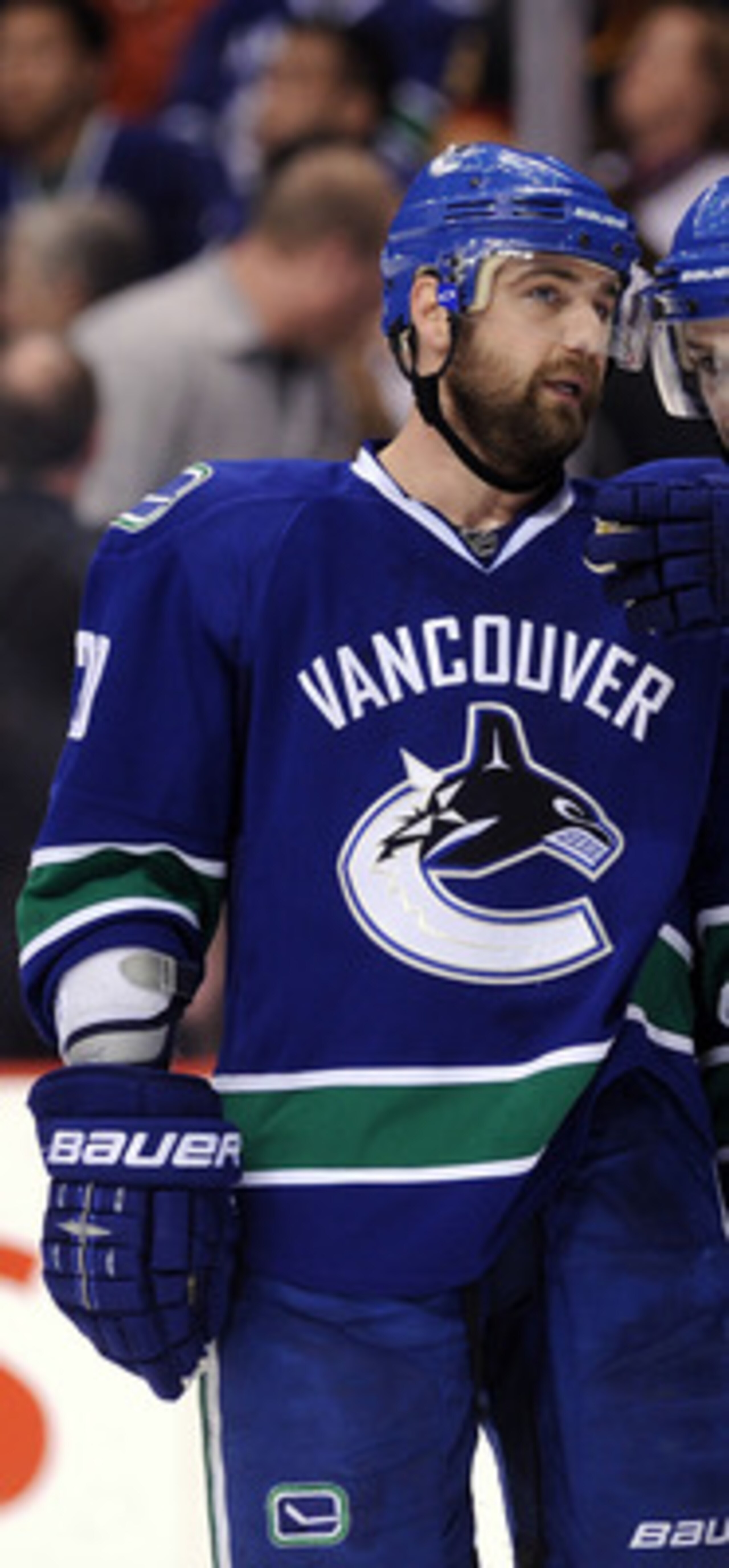 VANCOUVER, CANADA - MAY 18:  Christopher Higgins #20 and Mason Raymond #21 of the Vancouver Canucks confer during a break in Game Two of the Western Conference Finals against San Jose Sharks during the 2011 Stanley Cup Playoffs at Rogers Arena on May 18,