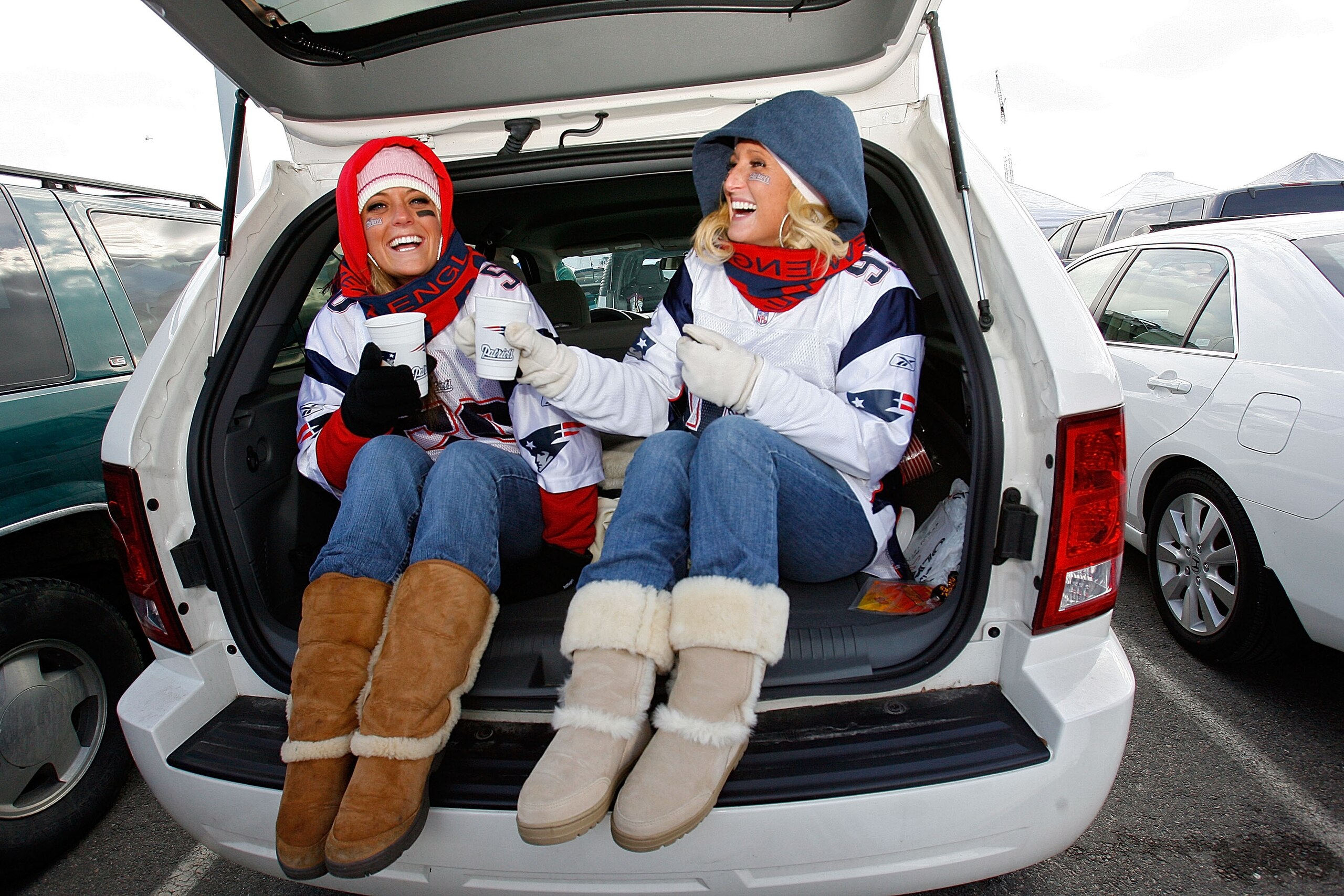 FOXBORO, MA - JANUARY 20:  New England Patriots fans Jaime Canty and Lisa Capone of Swampscott, Massachusetts tailgate before the AFC Championship Game agianst the San Diego Chargers on January 20, 2008 at Gillette Stadium in Foxboro, Massachusetts.  (Pho