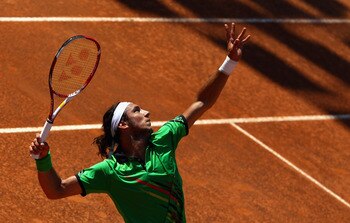 ROME, ITALY - MAY 10: Juan Monaco of Argentina  serve during his second round match against Tomas Berdych of Czech Republic during day three of the Internazoinali BNL D'Italia at the Foro Italico Tennis Centre on May 10, 2011 in Rome, Italy.  (Photo by Cl