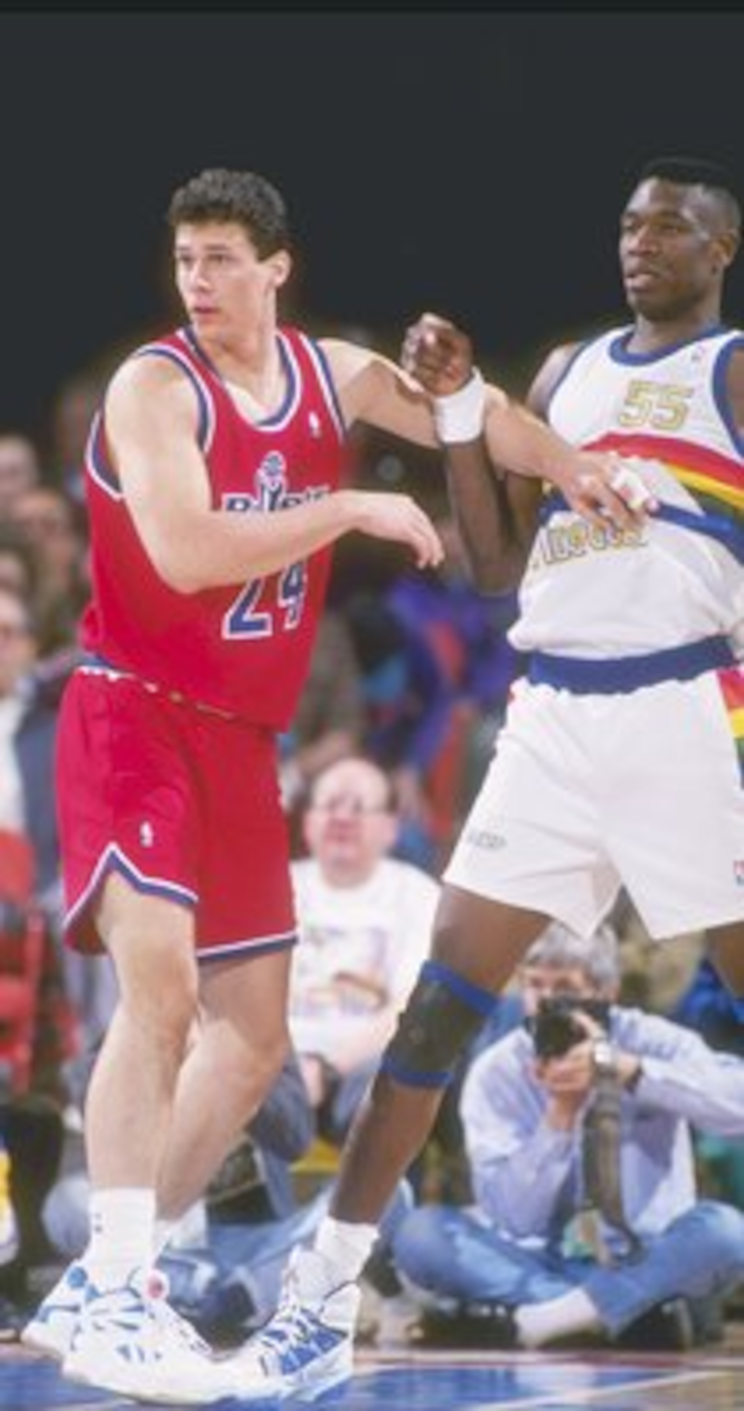 Forward Tom Gugliotta of the Washington Bullets stands on the court during a game against the Denver Nuggets at the McNichols Sports Arena in Denver, Colorado.
