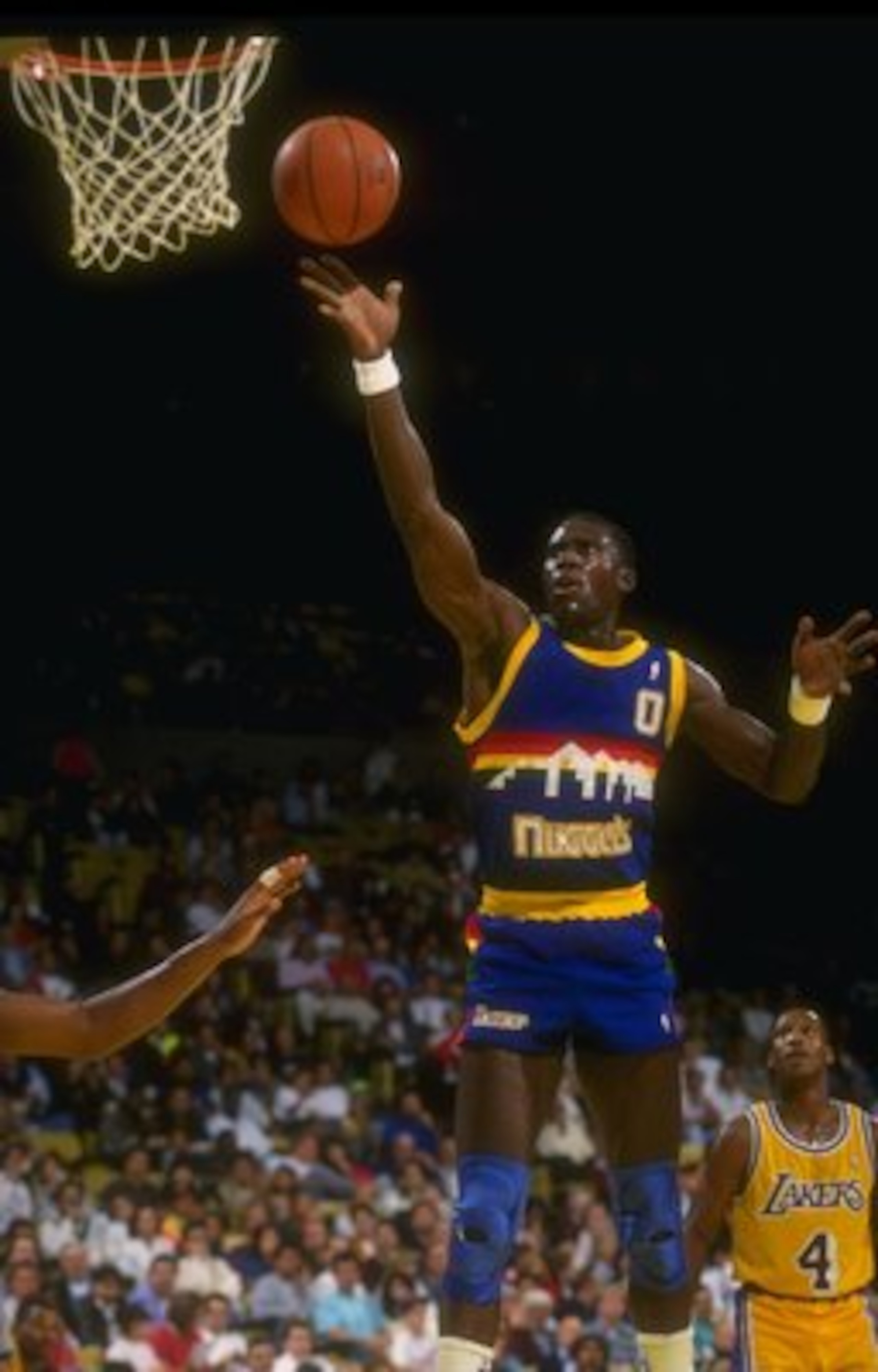 Forward Orlando Woolridge of the Denver Nuggets goes up for two during a game against the Los Angeles Lakers at Great Western Forum in Inglewood, California.