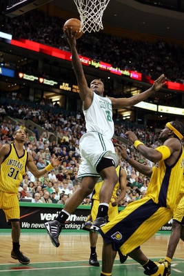 BOSTON - MAY 7:  Antoine Walker #8 of the Boston Celtics scores on a layup against the Indiana Pacers while Reggie Miller #31 of the Indiana Pacers watches in Game seven of the Eastern Conference Quarterfinals during the 2005 NBA Playoffs on May 7, 2005 a