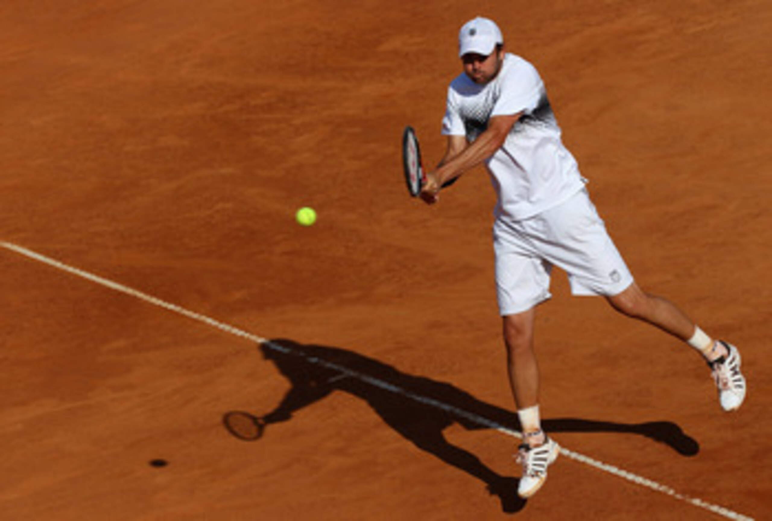 ROME, ITALY - MAY 09:  Mardy Fish of the USA plays a backhand during his first round match against Santiago Giraldo of Columbia during day two of the Internazoinali BNL D'Italia at the Foro Italico Tennis Centre on May 9, 2011 in Rome, Italy.  (Photo by C
