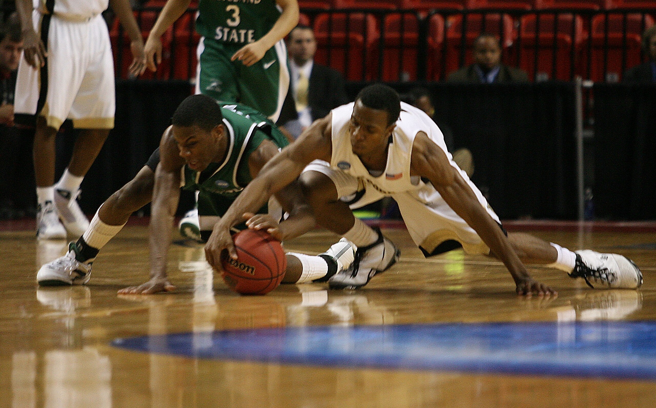MIAMI - MARCH 20:  Guard  Norris Cole #30 (L) of the Cleveland State University Vikings fights for a loose ball against guard  Ishmael Smith #10 (R) of Wake Forest Demon Deacons during the first round of the NCAA Division I Men's Basketball Tournament at