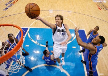 DALLAS, TX - MAY 19:  Dirk Nowitzki #41 of the Dallas Mavericks goes up for a shot past Nick Collison #4 of the Oklahoma City Thunder in the second half in Game Two of the Western Conference Finals during the 2011 NBA Playoffs at American Airlines Center
