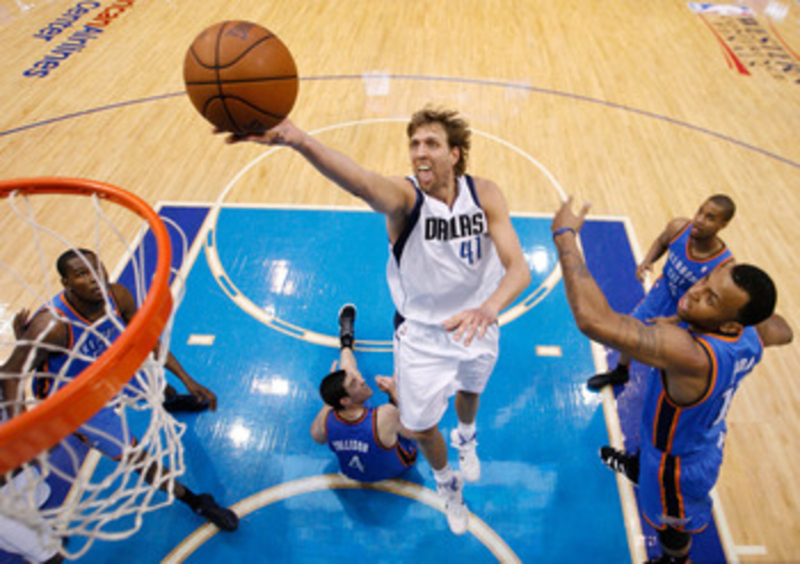 DALLAS, TX - MAY 19: Dirk Nowitzki #41 of the Dallas Mavericks goes up for a shot past Nick Collison #4 of the Oklahoma City Thunder in the second half in Game Two of the Western Conference Finals during the 2011 NBA Playoffs at American Airlines Center DALLAS, TX - MAY 19: Dirk Nowitzki #41 of the Dallas Mavericks goes up for a shot past Nick Collison #4 of the Oklahoma City Thunder in the second half in Game Two of the Western Conference Finals during the 2011 NBA Playoffs at American Airlines Center