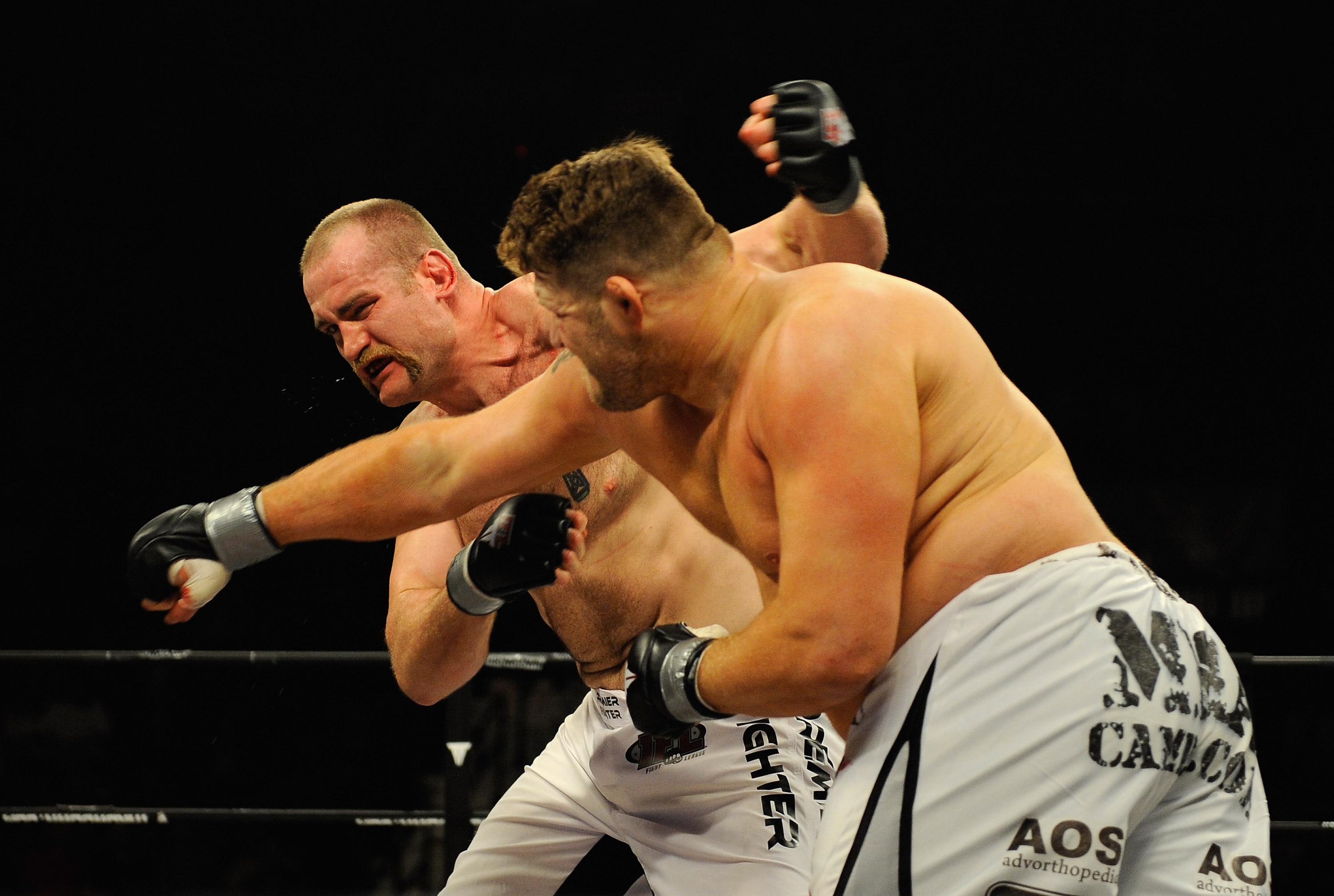 UNCASVILLE, CT - MAY 16:  Roy Nelson (L) of the Lions Den throws a punch at Brad Imes (R) MilesTech Fighting System during their bout presented by the International Fighting League at the Mohegan Sun Arena May 16, 2008 in Uncasville, Connecticut.  (Photo