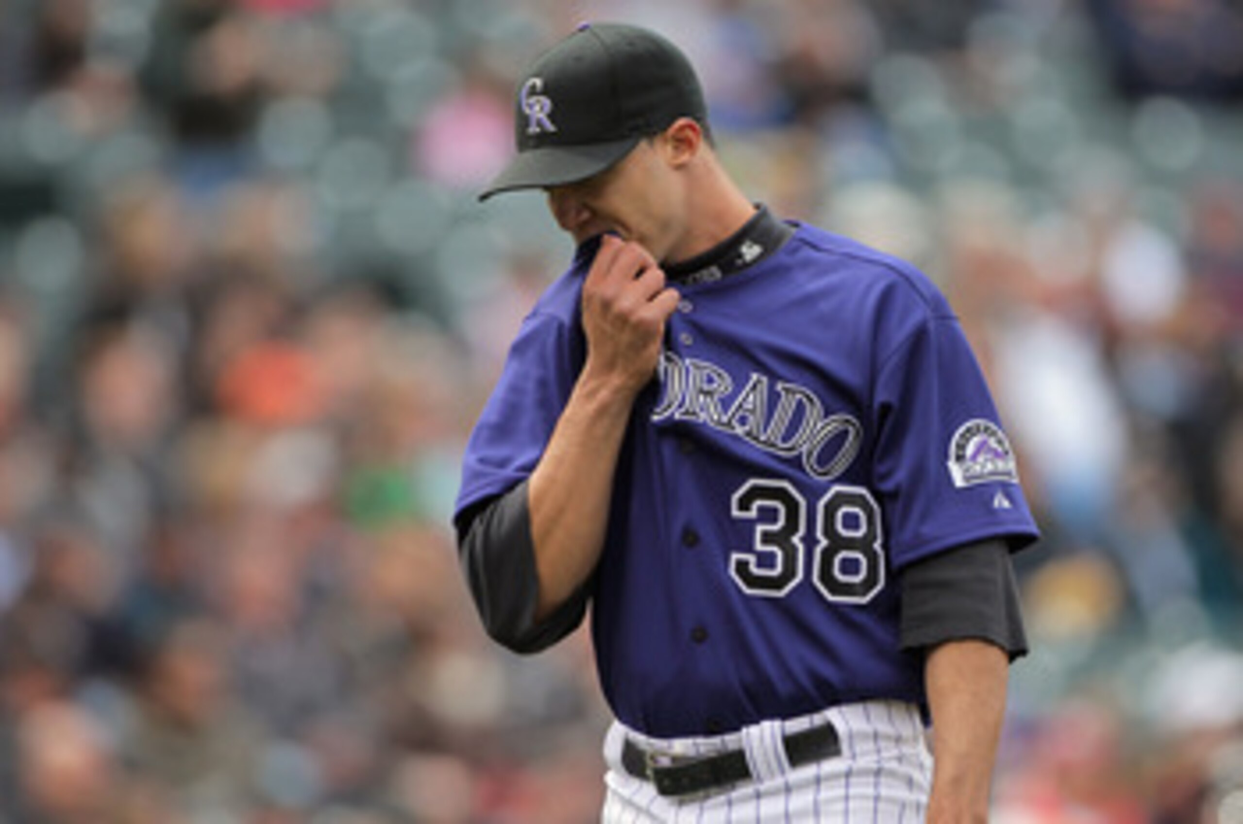 DENVER, CO - MAY 01:  Starting pitcher Ubaldo Jimenez #38 of the Colorado Rockies heads for the dugout at the end of the fourth inning agaisnt the Pittsburgh Pirates at Coors Field on May 1, 2011 in Denver, Colorado. Jimenez collected the loss as the Pira