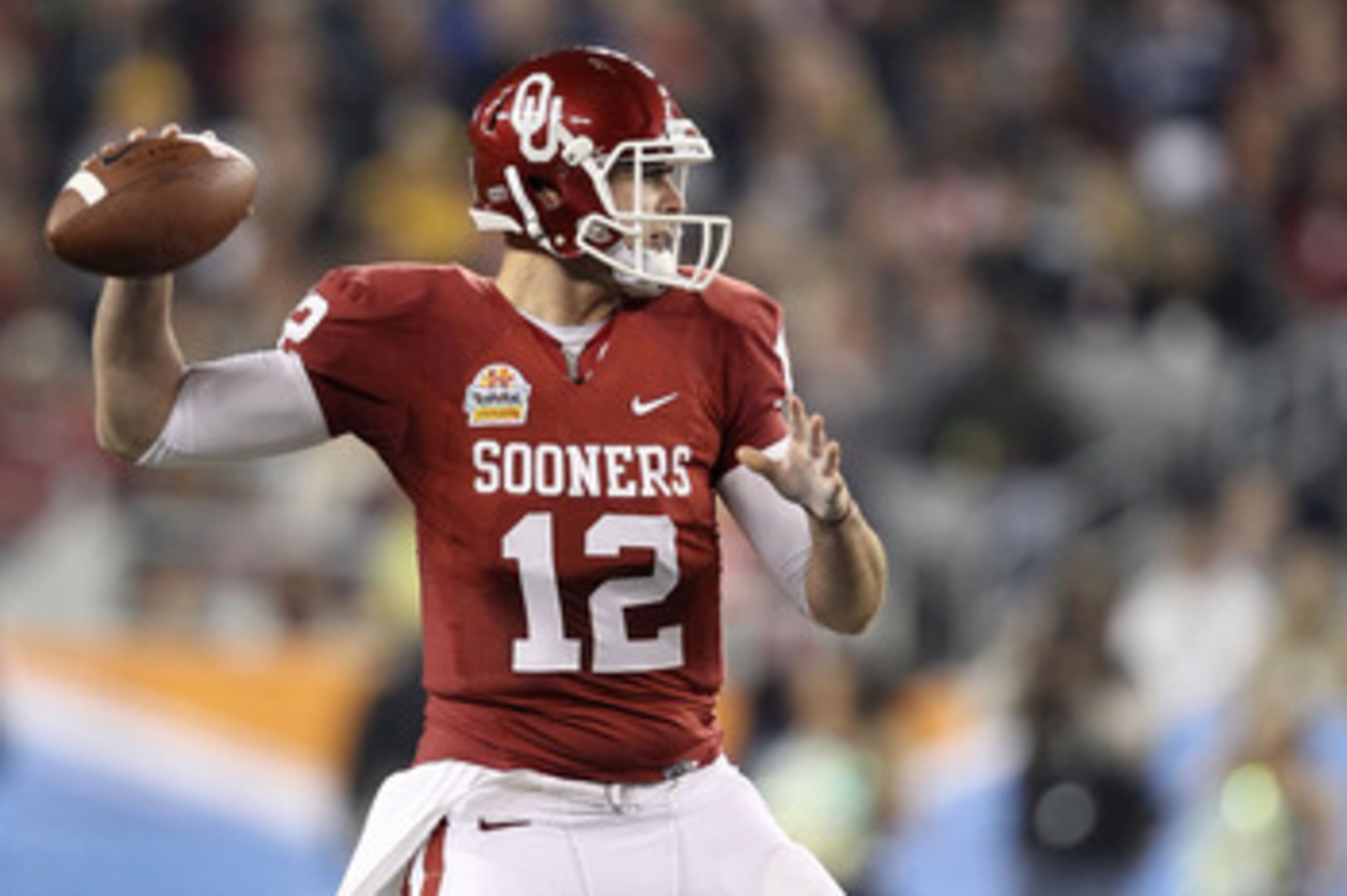 GLENDALE, AZ - JANUARY 01: Landry Jones #12 of the Oklahoma Sooners throws the ball in the second half against the Connecticut Huskies during the Tostitos Fiesta Bowl at the Universtity of Phoenix Stadium on January 1, 2011 in Glendale, Arizona. (Photo GLENDALE, AZ - JANUARY 01: Landry Jones #12 of the Oklahoma Sooners throws the ball in the second half against the Connecticut Huskies during the Tostitos Fiesta Bowl at the Universtity of Phoenix Stadium on January 1, 2011 in Glendale, Arizona. (Photo