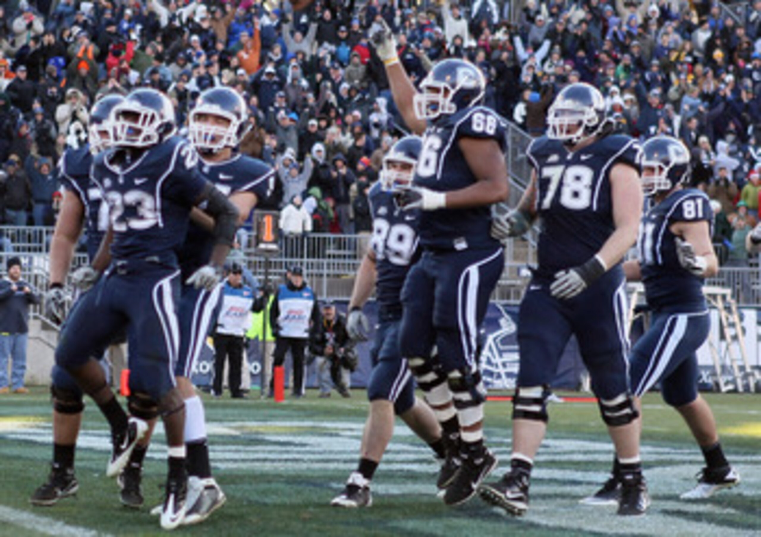 EAST HARTFORD, CT - NOVEMBER 27: Jordan Todman #23 of the Connecticut Huskies celebrates his touchdown with teammates Ryan Griffin #94, Kevin Friend #77 and Mathieu Olivier #66 in the fourth quarter against the Cincinnati Bearcats on November 27, 2010 at EAST HARTFORD, CT - NOVEMBER 27: Jordan Todman #23 of the Connecticut Huskies celebrates his touchdown with teammates Ryan Griffin #94, Kevin Friend #77 and Mathieu Olivier #66 in the fourth quarter against the Cincinnati Bearcats on November 27, 2010 at