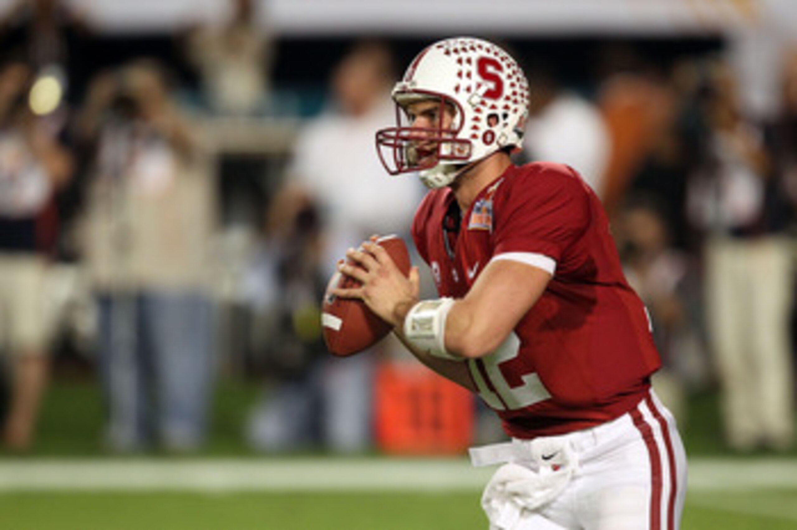 MIAMI, FL - JANUARY 03: Quarterback Andrew Luck #12 of the Stanford Cardinal rolls out of the pocket against the Virginia Tech Hokies during the 2011 Discover Orange Bowl at Sun Life Stadium on January 3, 2011 in Miami, Florida. Stanford won 40-12. (Pho MIAMI, FL - JANUARY 03: Quarterback Andrew Luck #12 of the Stanford Cardinal rolls out of the pocket against the Virginia Tech Hokies during the 2011 Discover Orange Bowl at Sun Life Stadium on January 3, 2011 in Miami, Florida. Stanford won 40-12. (Pho