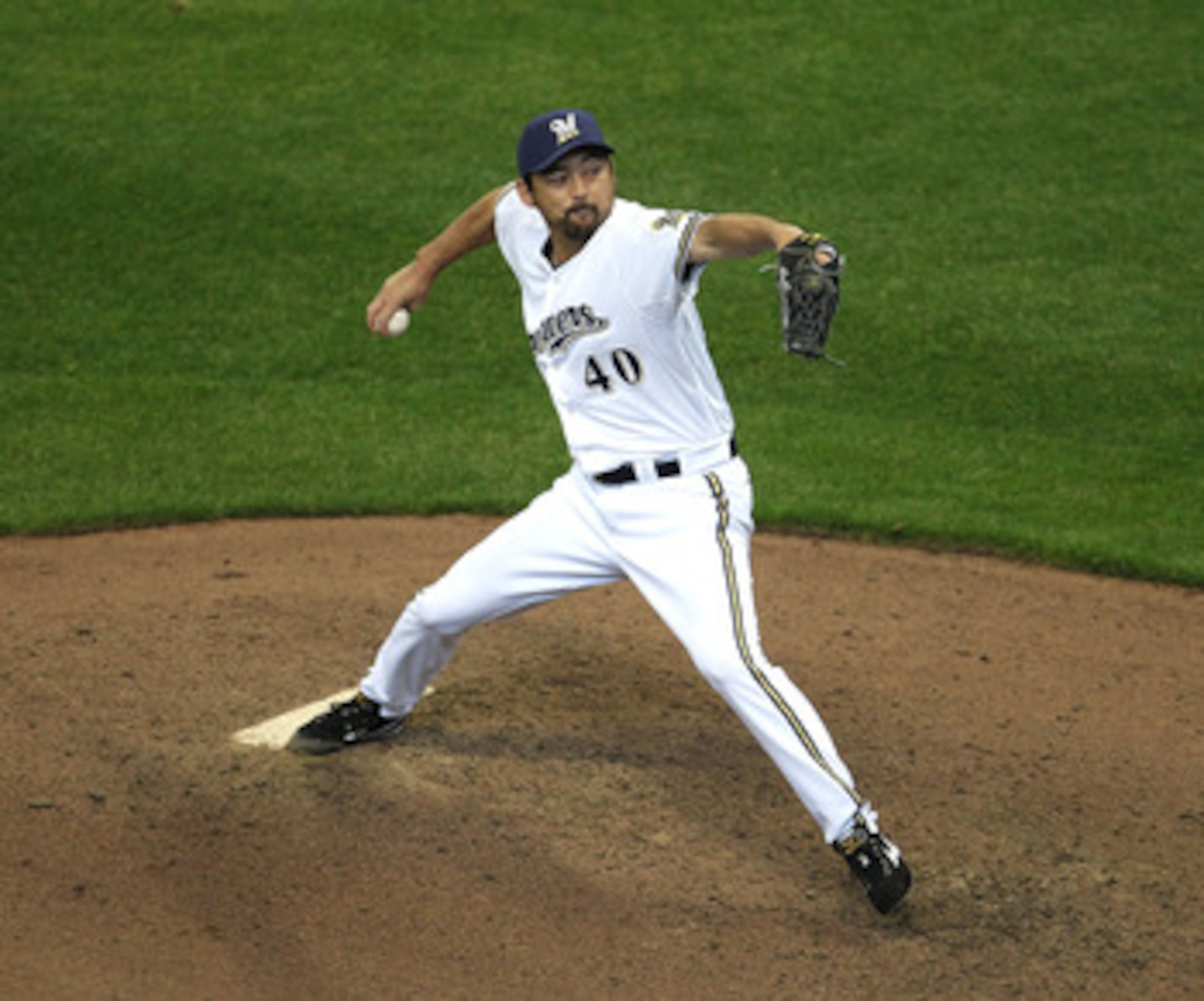 MILWAUKEE, WI - APRIL 04: Takashi Saito #40 of the Milwaukee Brewers gave up two solo home runs in the 8th inning to the Atlanta Braves during the home opener at Miller Park on April 4, 2011 in Milwaukee, Wisconsin. The Braves defeated the Brewers 2-1. (P
