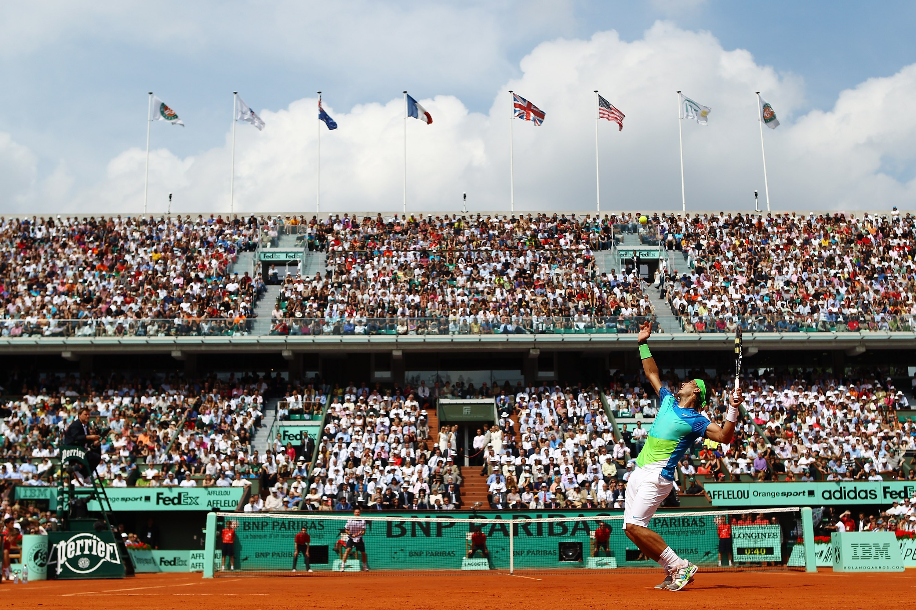 PARIS - JUNE 06: Rafael Nadal of Spain serves during the men's singles final match between Rafael Nadal of Spain and Robin Soderling of Sweden on day fifteen of the French Open at Roland Garros on June 6, 2010 in Paris, France. (Photo by Julian Finney/G PARIS - JUNE 06: Rafael Nadal of Spain serves during the men's singles final match between Rafael Nadal of Spain and Robin Soderling of Sweden on day fifteen of the French Open at Roland Garros on June 6, 2010 in Paris, France. (Photo by Julian Finney/G
