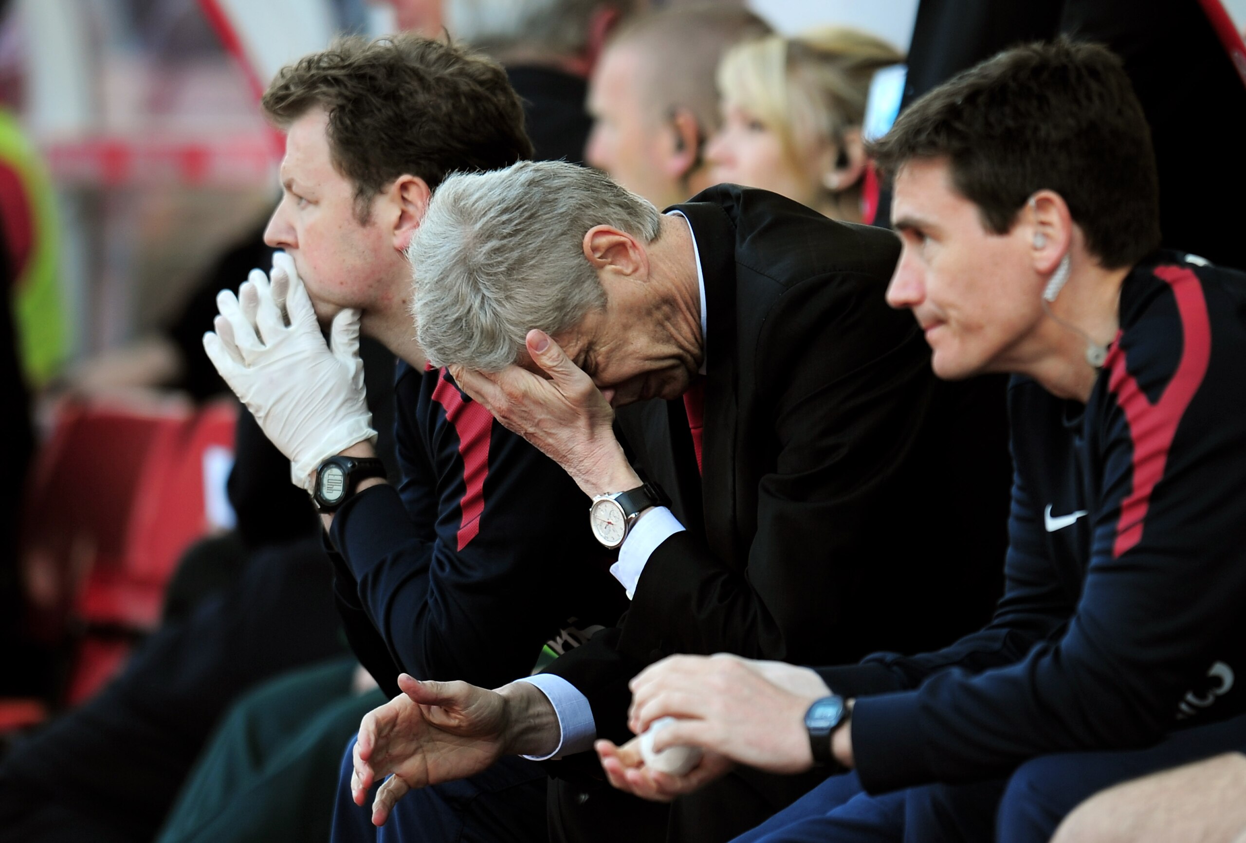 STOKE ON TRENT, ENGLAND - MAY 08:  A dejected Arsene Wenger the Arsenal manager holds his head in his hands as his team head towards a 3-1 defeat during the Barclays Premier League match between Stoke City and Arsenal at the Britannia Stadium on May 8, 20