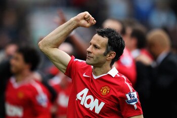 BLACKBURN, ENGLAND - MAY 14:  Ryan Giggs of Manchester United pumps his fist to the fans after drawing the Barclays Premier League match between Blackburn Rovers and Manchester United but winning the title at Ewood park on May 14, 2011 in Blackburn, Engla