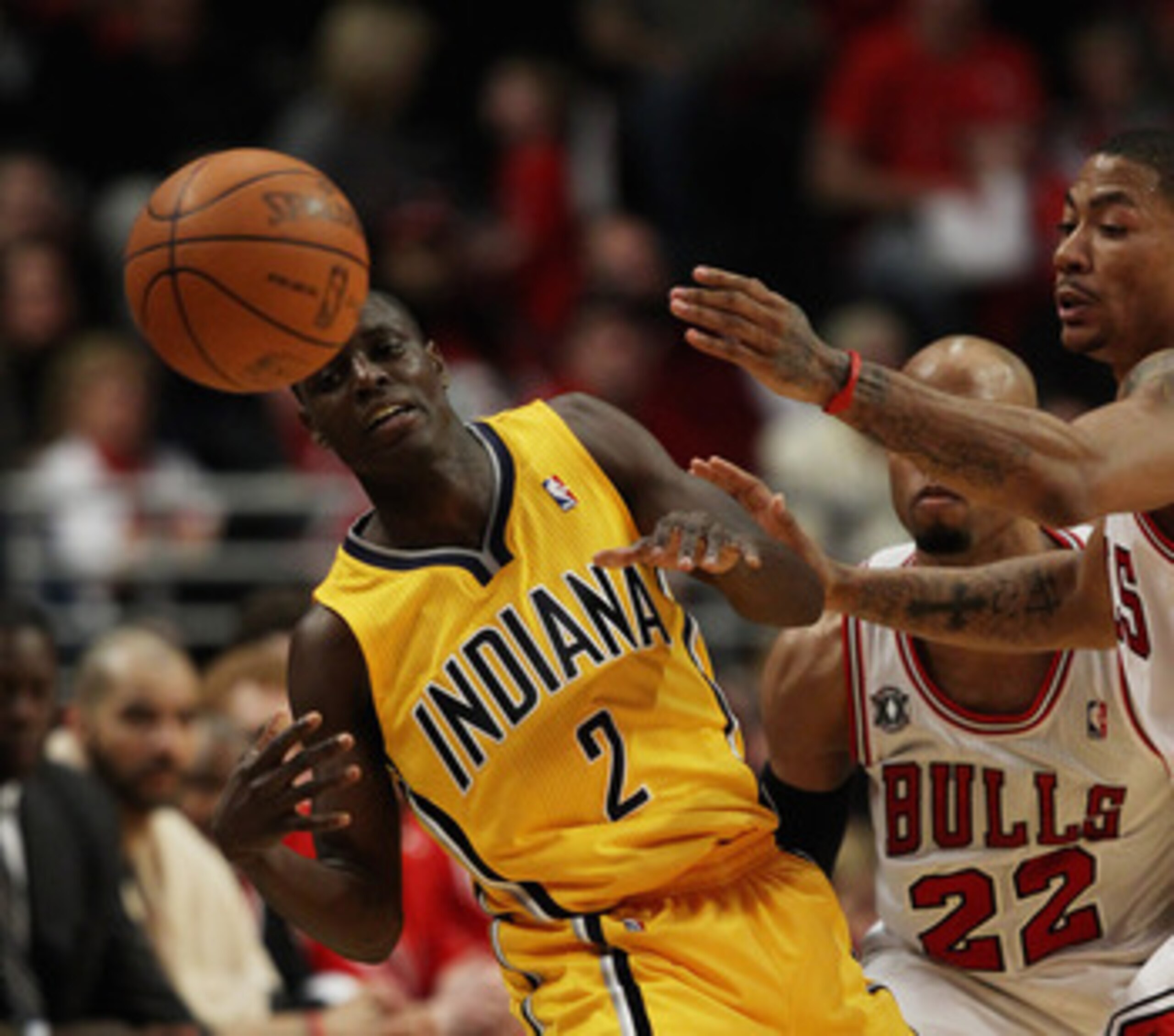 CHICAGO, IL - APRIL 26: Darren Collison #2 of the Indiana Pacers looses control of the ball under pressure from Derrick Rose #1 and Taj Gibson #22 of the Chicago Bulls in Game Five of the Eastern Conference Quarterfinals in the 2011 NBA Playoffs at the Un CHICAGO, IL - APRIL 26: Darren Collison #2 of the Indiana Pacers looses control of the ball under pressure from Derrick Rose #1 and Taj Gibson #22 of the Chicago Bulls in Game Five of the Eastern Conference Quarterfinals in the 2011 NBA Playoffs at the Un