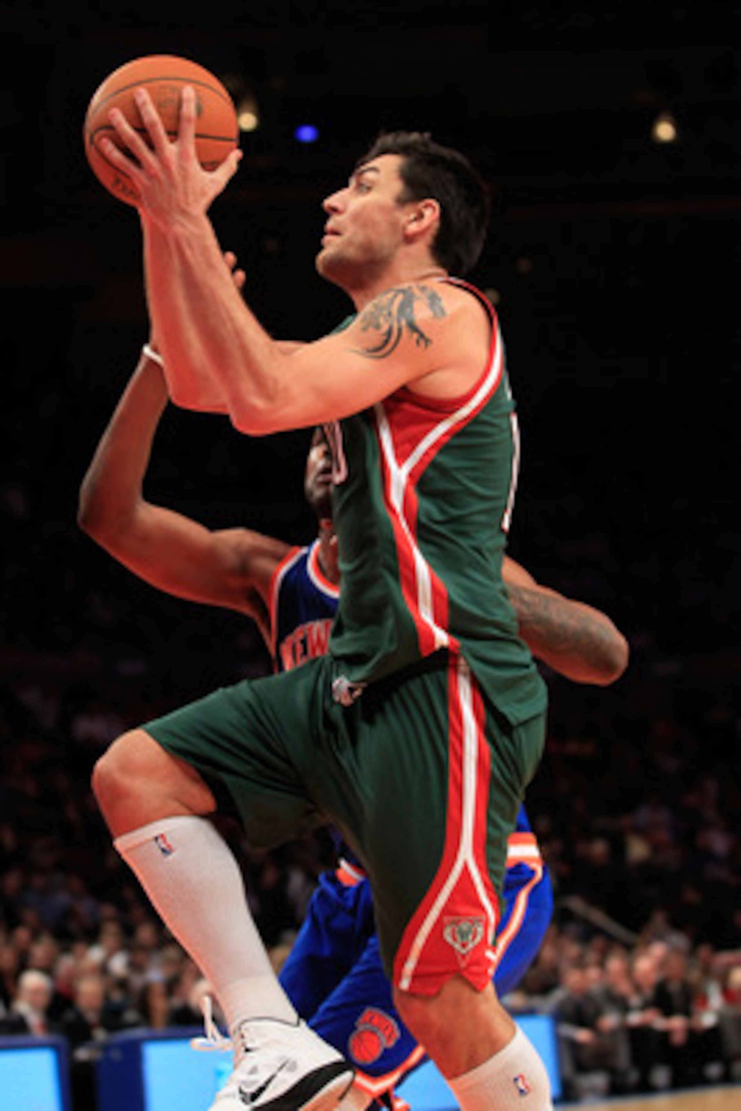 NEW YORK, NY - FEBRUARY 23: Carlos Delfino #10 of the Milwaukee Bucks shoots the ball against the New York Knicks at Madison Square Garden on February 23, 2011 in New York City. NOTE TO USER: User expressly acknowledges and agrees that, by downloading and