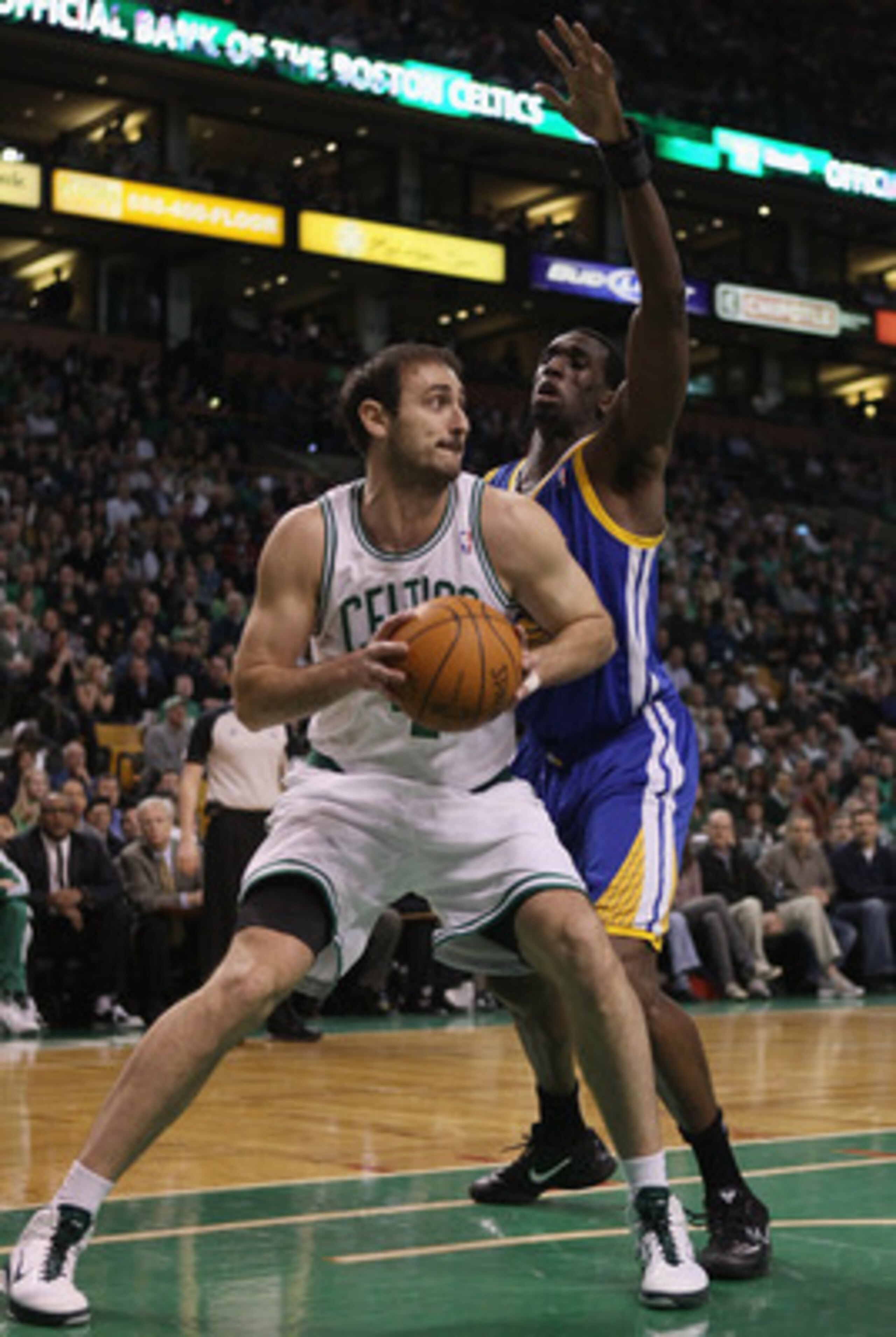 BOSTON, MA - MARCH 04:  Nenad Krstic #4 of the Boston Celtics heads for the net as Ekpe Udoh #20 of the Golden State Warriors defends on March 4, 2011 at the TD Garden in Boston, Massachusetts.  NOTE TO USER: User expressly acknowledges and agrees that, b