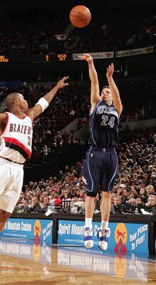 PORTLAND, OR - DECEMBER 12:  Raul Lopez #24 of the Utah Jazz shoots a jump shot against the Portland Trail Blazers on December 12, 2004 at the Rose Garden in Portland, Oregon. The Blazers won 98-88. NOTE TO USER: User expressly acknowledges and agrees tha