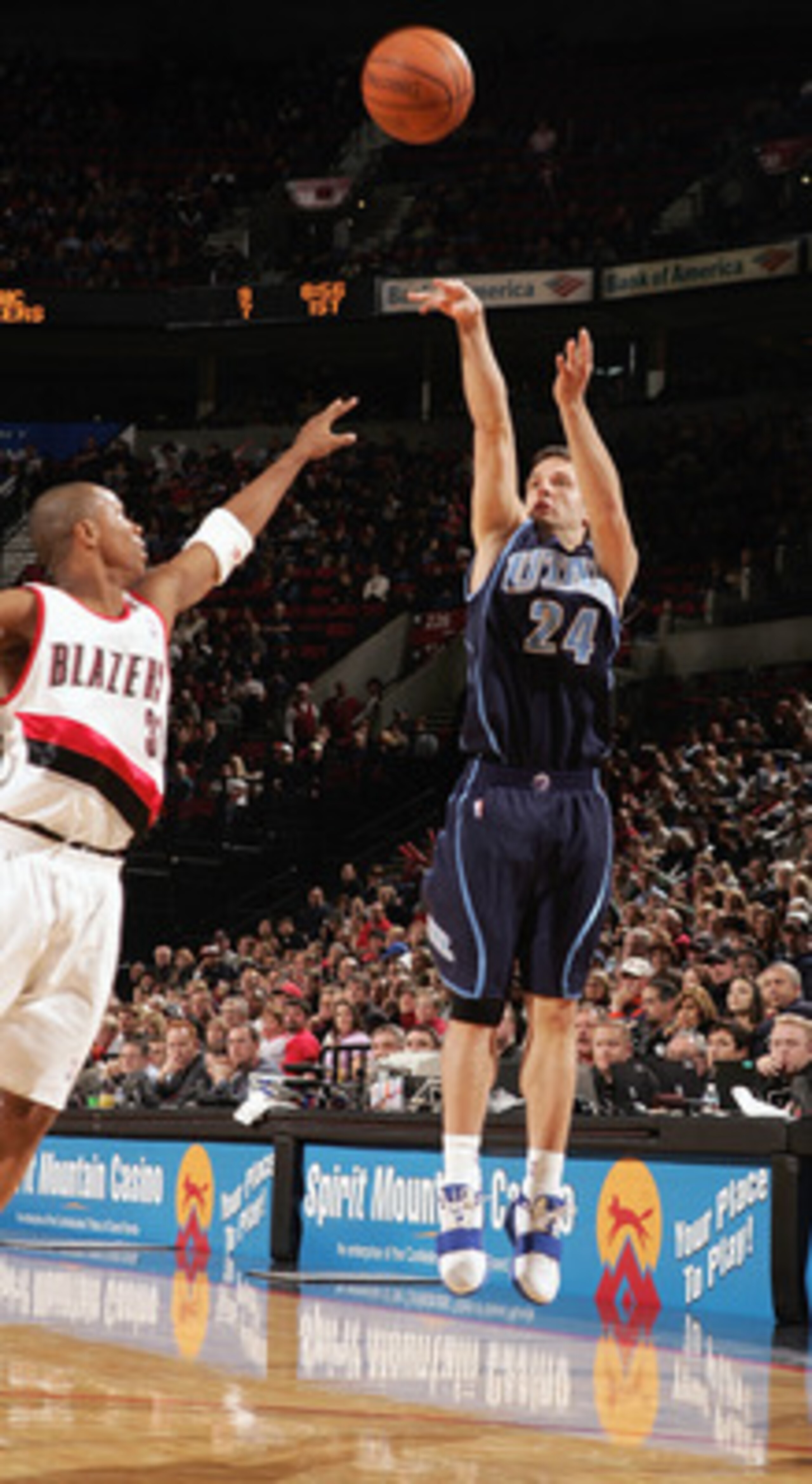 PORTLAND, OR - DECEMBER 12:  Raul Lopez #24 of the Utah Jazz shoots a jump shot against the Portland Trail Blazers on December 12, 2004 at the Rose Garden in Portland, Oregon. The Blazers won 98-88. NOTE TO USER: User expressly acknowledges and agrees tha