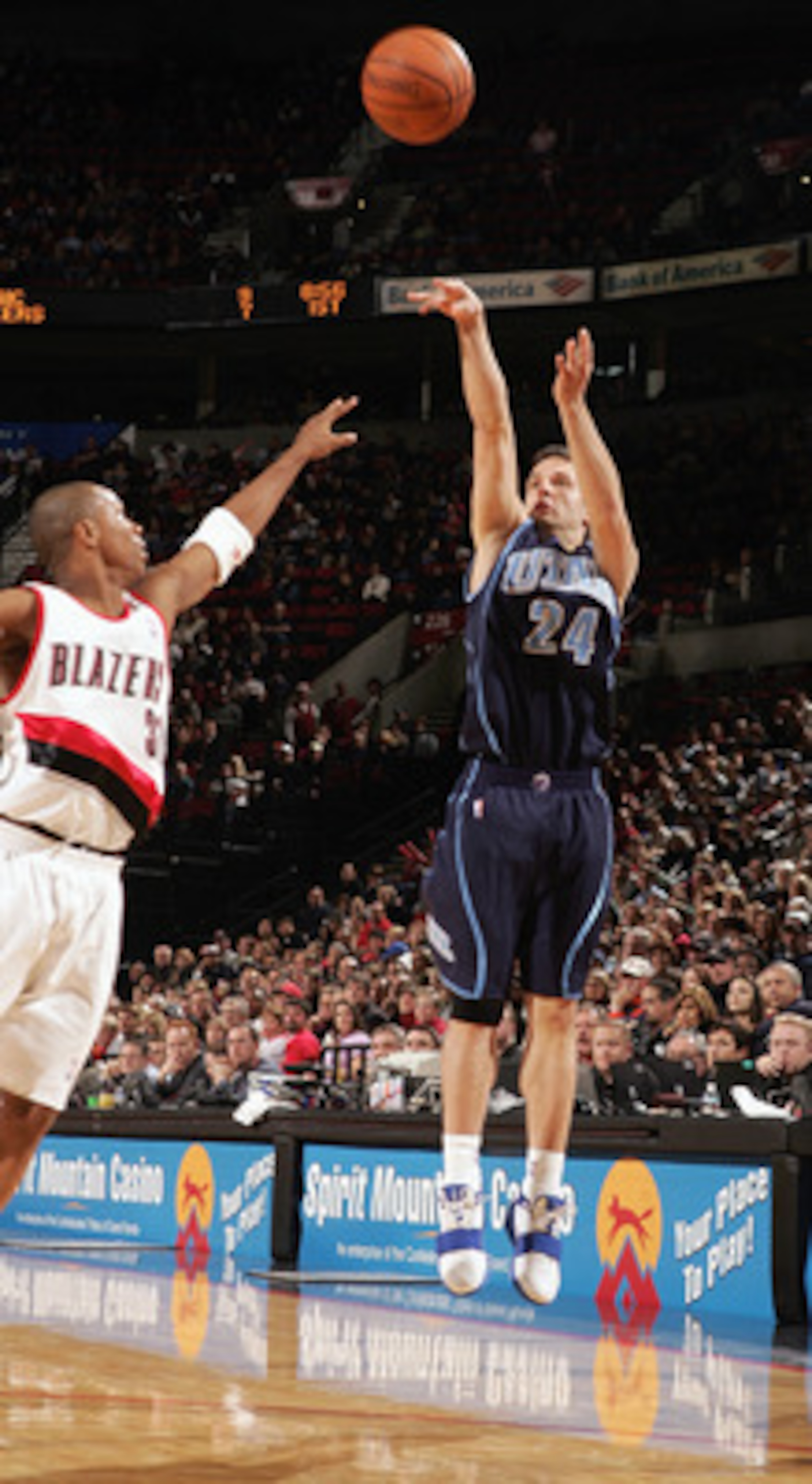 PORTLAND, OR - DECEMBER 12:  Raul Lopez #24 of the Utah Jazz shoots a jump shot against the Portland Trail Blazers on December 12, 2004 at the Rose Garden in Portland, Oregon. The Blazers won 98-88. NOTE TO USER: User expressly acknowledges and agrees tha