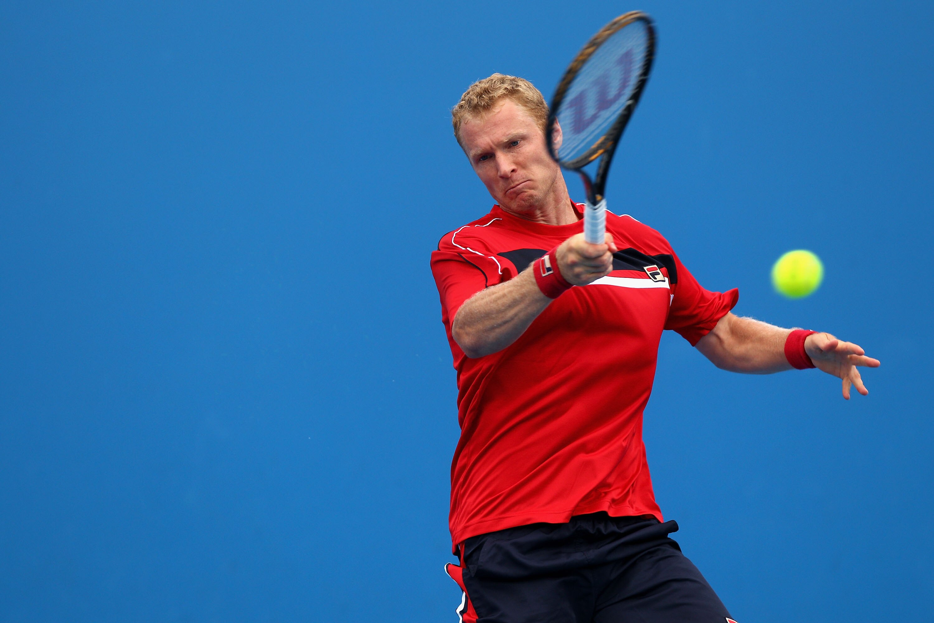 MELBOURNE, AUSTRALIA - JANUARY 17: Dmitry Tursunov of Russia plays a forehand during his first round match against Viktor Troicki of Serbia during day one of the 2011 Australian Open at Melbourne Park on January 17, 2011 in Melbourne, Australia. (Photo MELBOURNE, AUSTRALIA - JANUARY 17: Dmitry Tursunov of Russia plays a forehand during his first round match against Viktor Troicki of Serbia during day one of the 2011 Australian Open at Melbourne Park on January 17, 2011 in Melbourne, Australia. (Photo