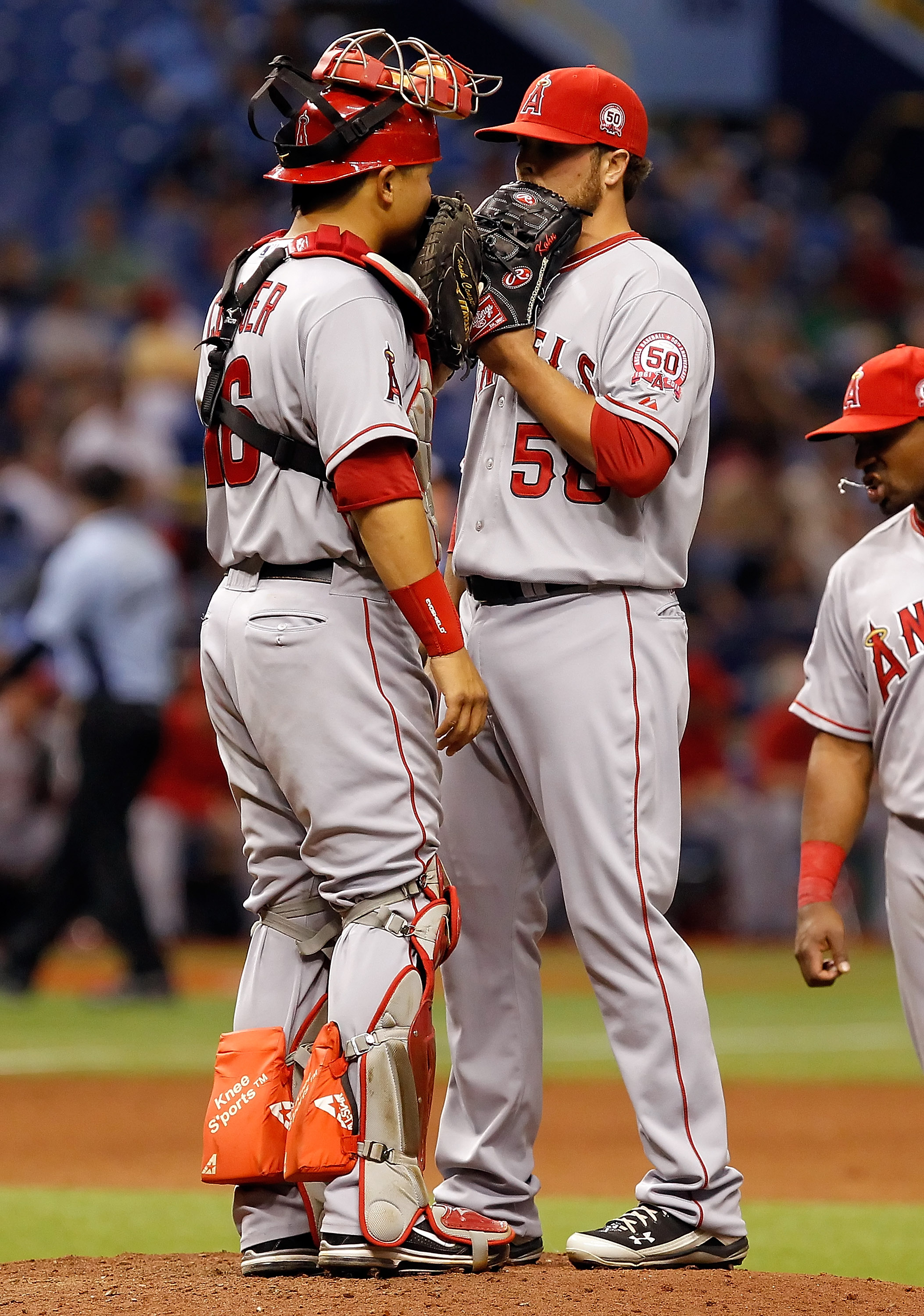 ST. PETERSBURG, FL - APRIL 05:  Pitcher Michael Kohn #58 of the Los Angeles Angels of Anaheim talks with catcher Hank Conger #16 during the game against the Tampa Bay Rays at Tropicana Field on April 5, 2011 in St. Petersburg, Florida.  (Photo by J. Meric