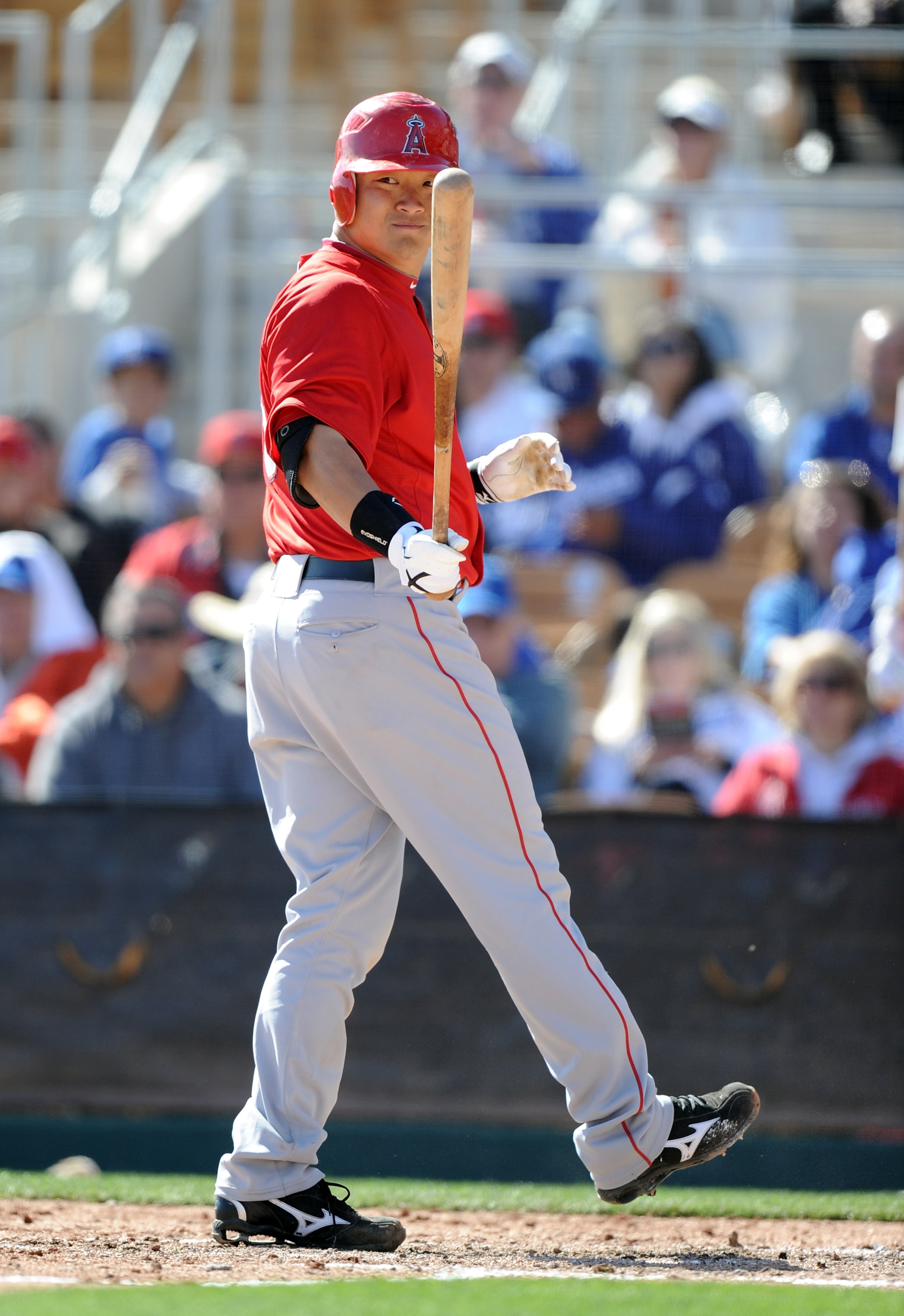PHOENIX, AZ - FEBRUARY 27:  Hank Conger #16 of the Los Angeles Angels of Anaheim reacts to his strikeout against the Los Angeles Dodgers during spring training at Camelback Ranch on February 27, 2011 in Phoenix, Arizona.  (Photo by Harry How/Getty Images)