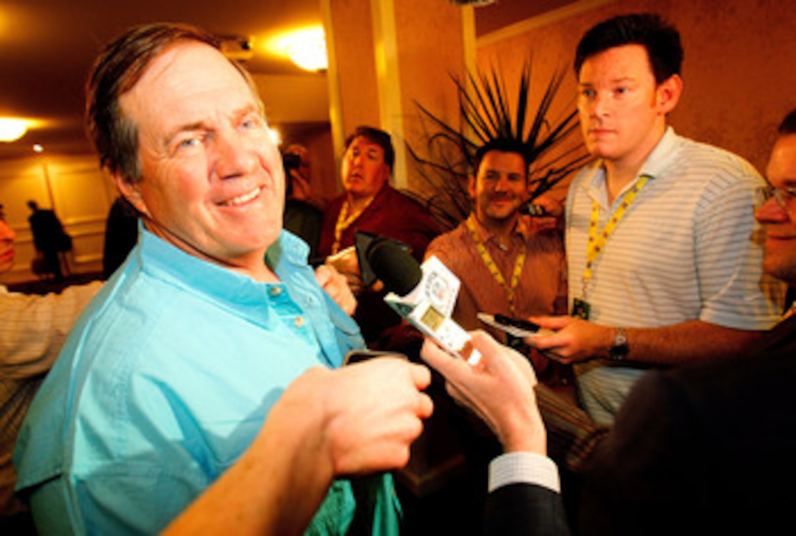 NEW ORLEANS, LA - MARCH 21: New England Patriot head coach Bill Belichick jokes with the media after missing breakfast during the NFL Annual Meetings at the Roosevelt Hotel on March 21, 2011 in New Orleans, Louisiana. Despite a NFL owners imposed lockout 