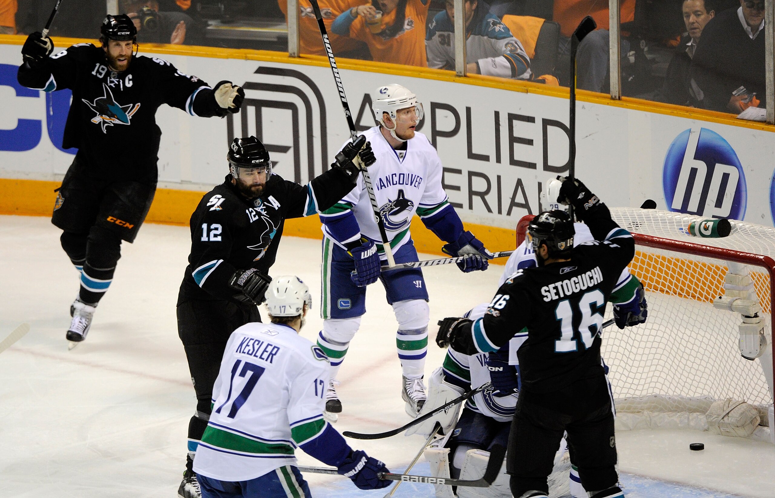 SAN JOSE, CA - MAY 20:  Patrick Marleau #12 of the San Jose Sharks reacts after his first of two first period goals as Christian Ehrhoff #5 of the Vancouver Canucks looks on in Game Three of the Western Conference Finals during the 2011 Stanley Cup Playof