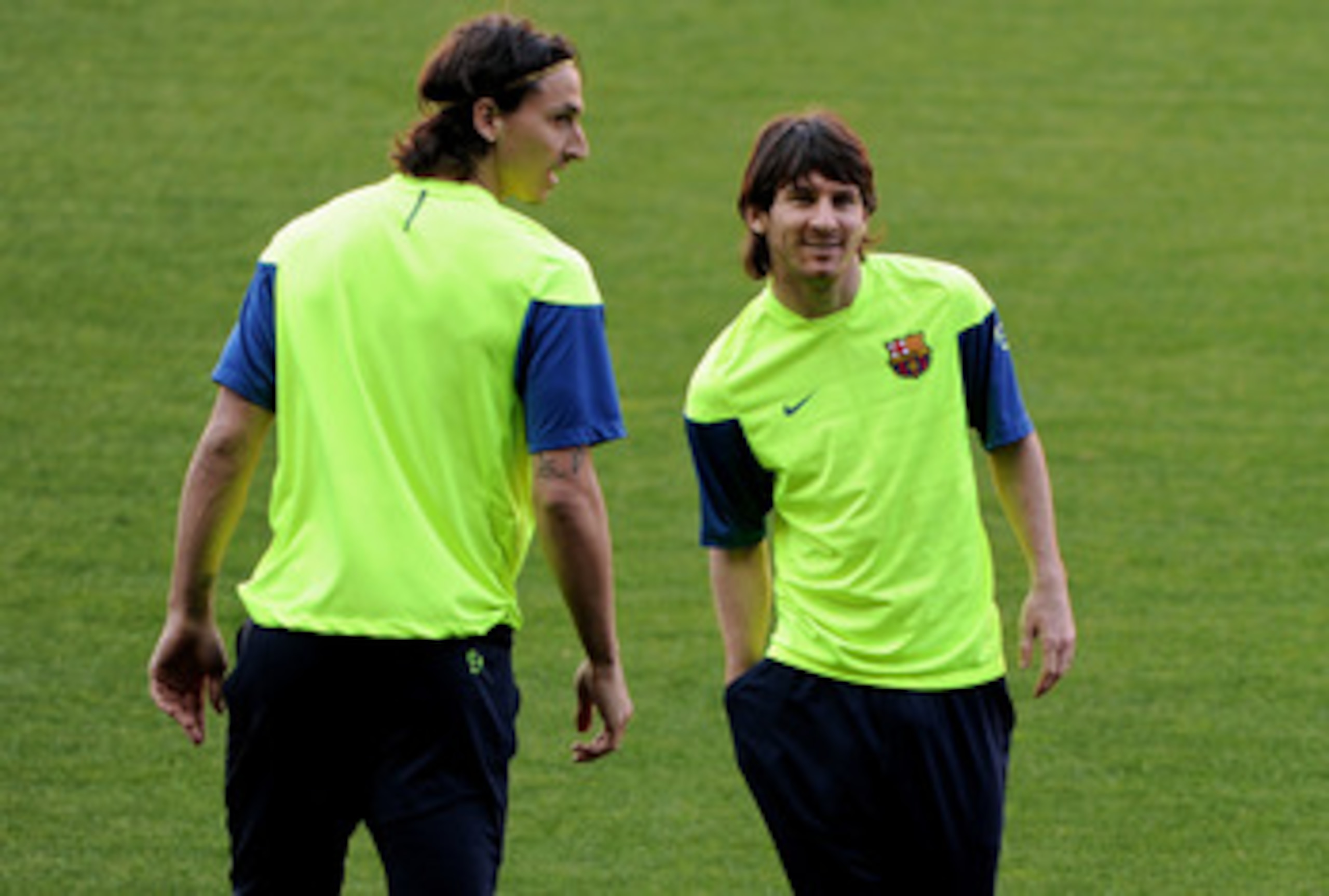 BARCELONA, SPAIN - APRIL 27:  Lionel Messi (R) of FC Barcelona strands flanked by his teammate Zlatan Ibrahimovic during a training session ahead of their UEFA Champions League semi final second leg match against Inter Milan at the Camp Nou stadium on Apr