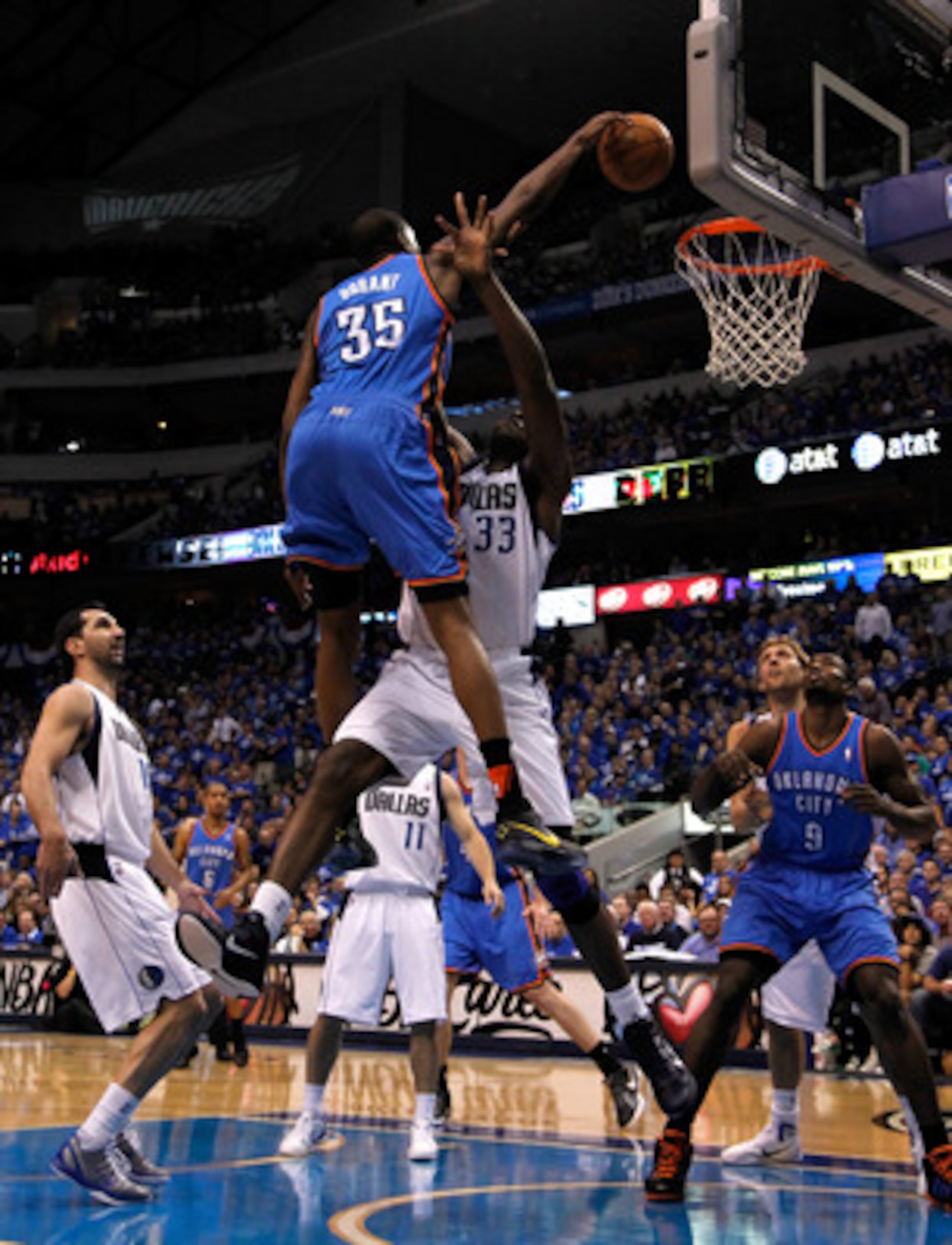 DALLAS, TX - MAY 19:  Kevin Durant #35 of the Oklahoma City Thunder dunks the ball over Brendan Haywood #33 of the Dallas Mavericks as Haywood is called for a foul in the first quarter in Game Two of the Western Conference Finals during the 2011 NBA Playo
