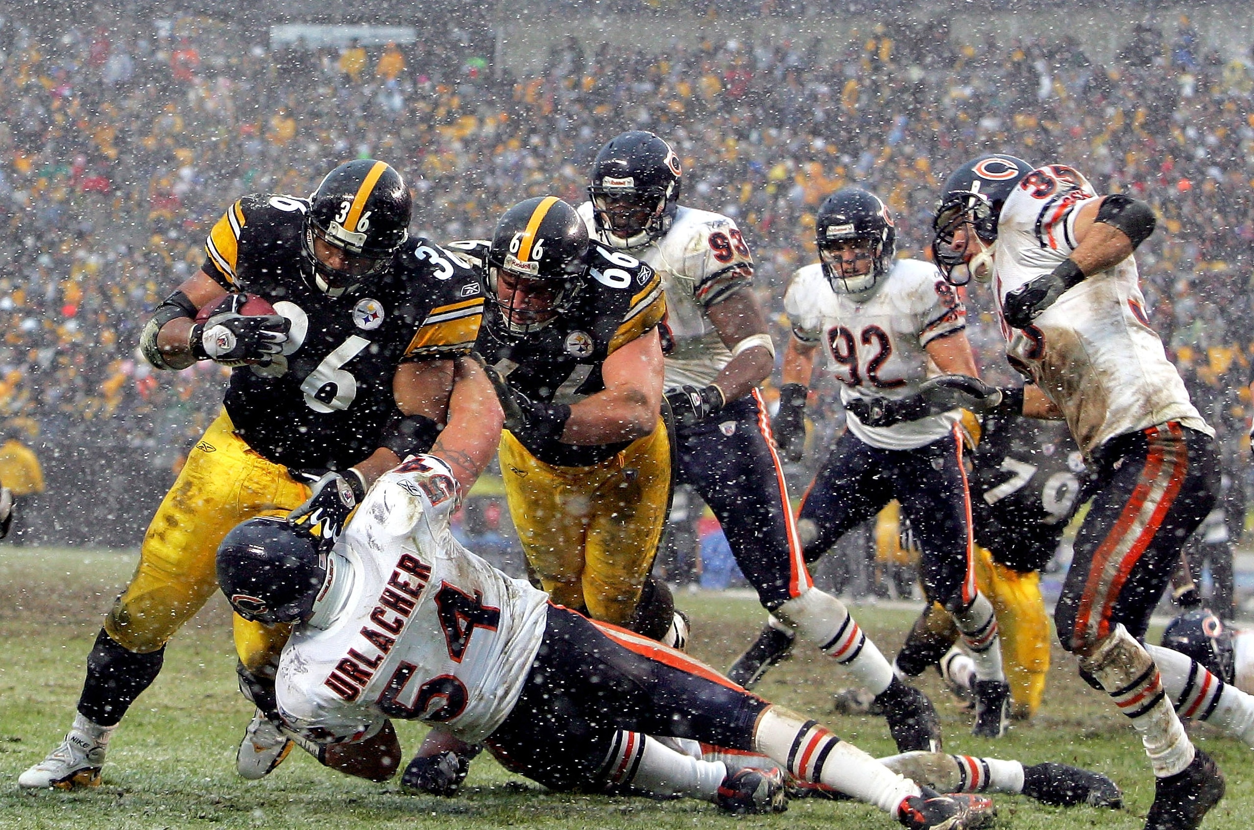 PITTSBURGH - DECEMBER 11:  Jerome Bettis #36 of the Pittsburgh Steelers runs over Brian Urlacher #54 the Chicago Bears for a touchdown on December 11, 2005 at Heinz Field in Pittsburgh, Pennsylvania. The Steelers defeated the Bears 21-9.  (Photo by Ezra S