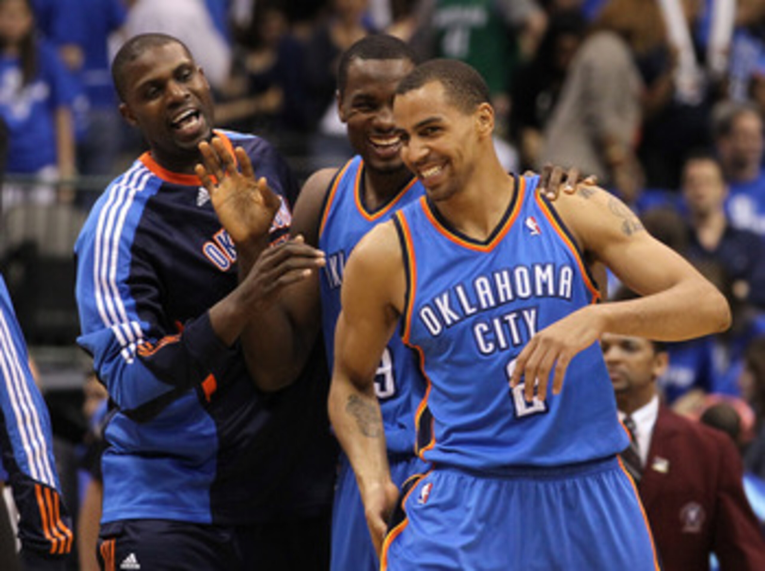 DALLAS, TX - MAY 19:  (R-L) Thabo Sefolosha #2, Serge Ibaka #9 and Nazr Mohammed #8 of the Oklahoma City Thunder react late in the fourth quarter before the Thunder defeat the Dallas Mavericks 106-100 in Game Two of the Western Conference Finals during th