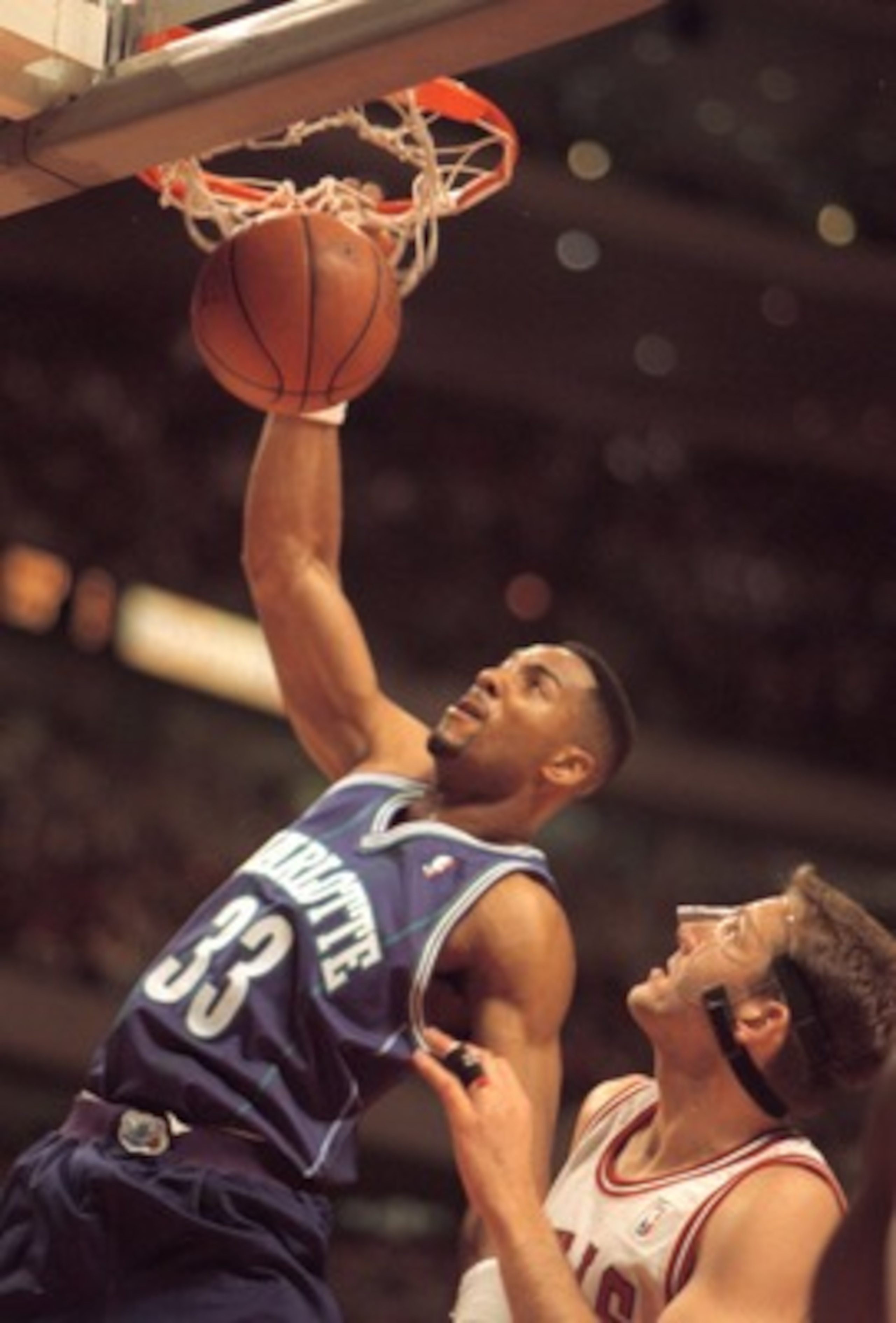 2 MAY 1995:  CHARLOTTE HORNET FORWARD ALONZO MOURNING #33 SLAMS TWO DOWN OVER CHICAGO BULLS WILL PERDUE DURING FIRST QUARTER ACTION OF THEIR FIRST ROUND NBA PLAYOFF GAME AT THE UNITED CENTER IN CHICAGO, ILLINOIS.  Mandatory Credit: Jonathan Daniel/ALLSPOR