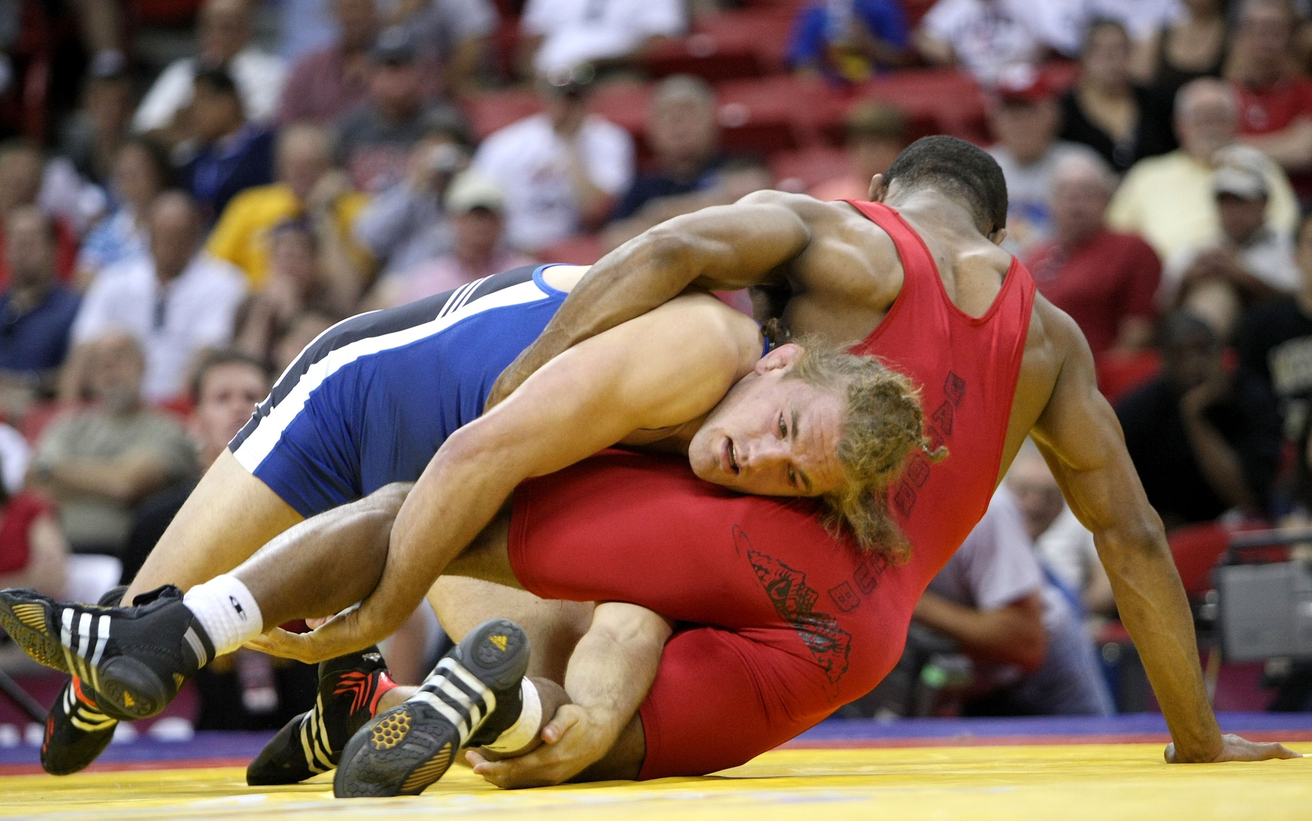 LAS VEGAS - JUNE 15:  Ben Askren (blue) wrestles Tyrone Lewis (red) in the Freestyle 74kg division championship match during the USA Olympic trials for wrestling and judo on June 15, 2008 at the Thomas & Mack Center in Las Vegas, Neveda.  (Photo by Jonath