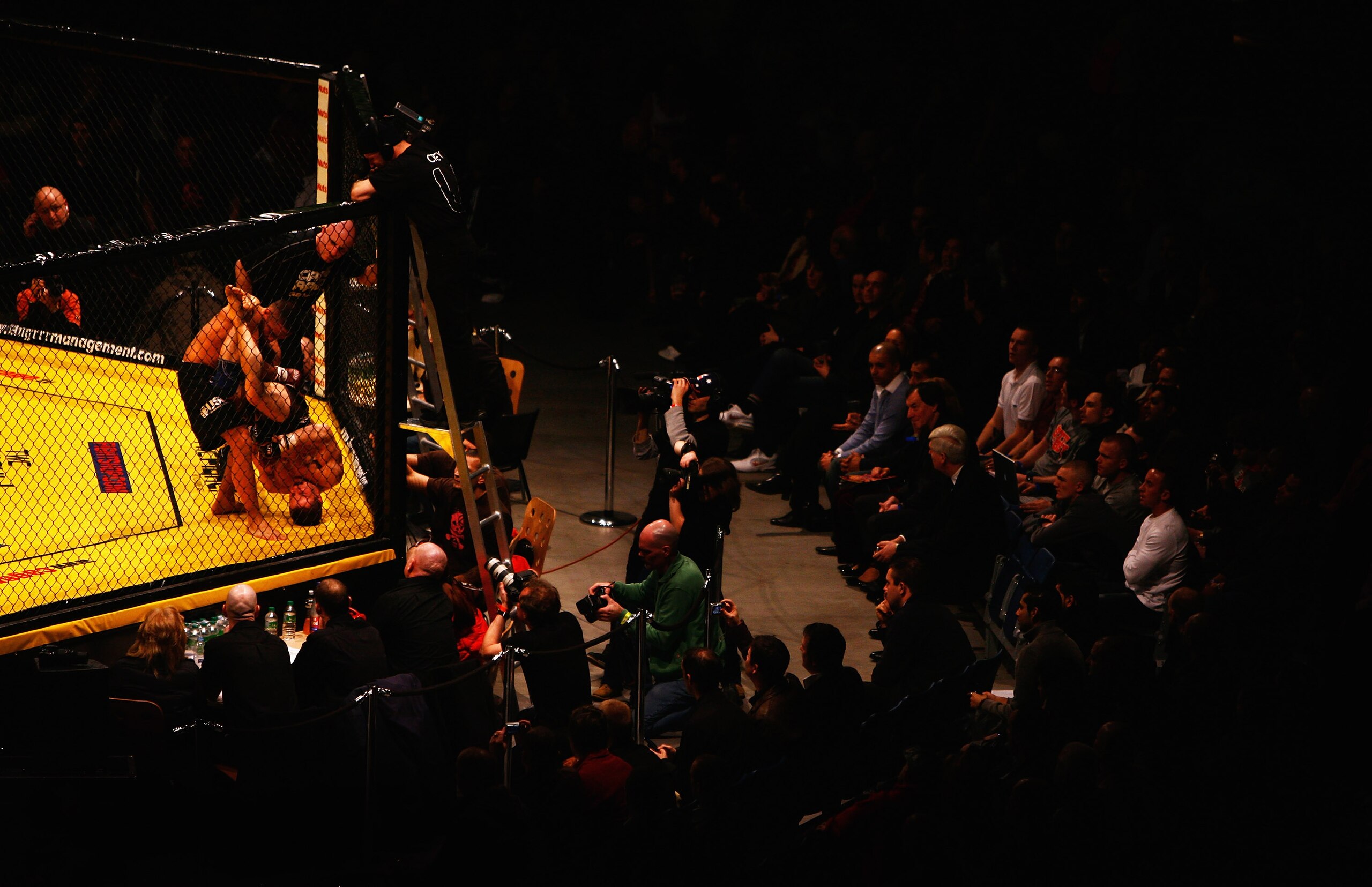 LONDON - FEBRUARY 10:  Ashleigh Grimshaw is flipped by Ronnie Mann during the Cage Rage Championship 20 Born to fight event at Wembley Arena on February 10, 2007 in London, England. Cage Fighting also known as MMA, Mixed Martial Arts is a mixed fighting s