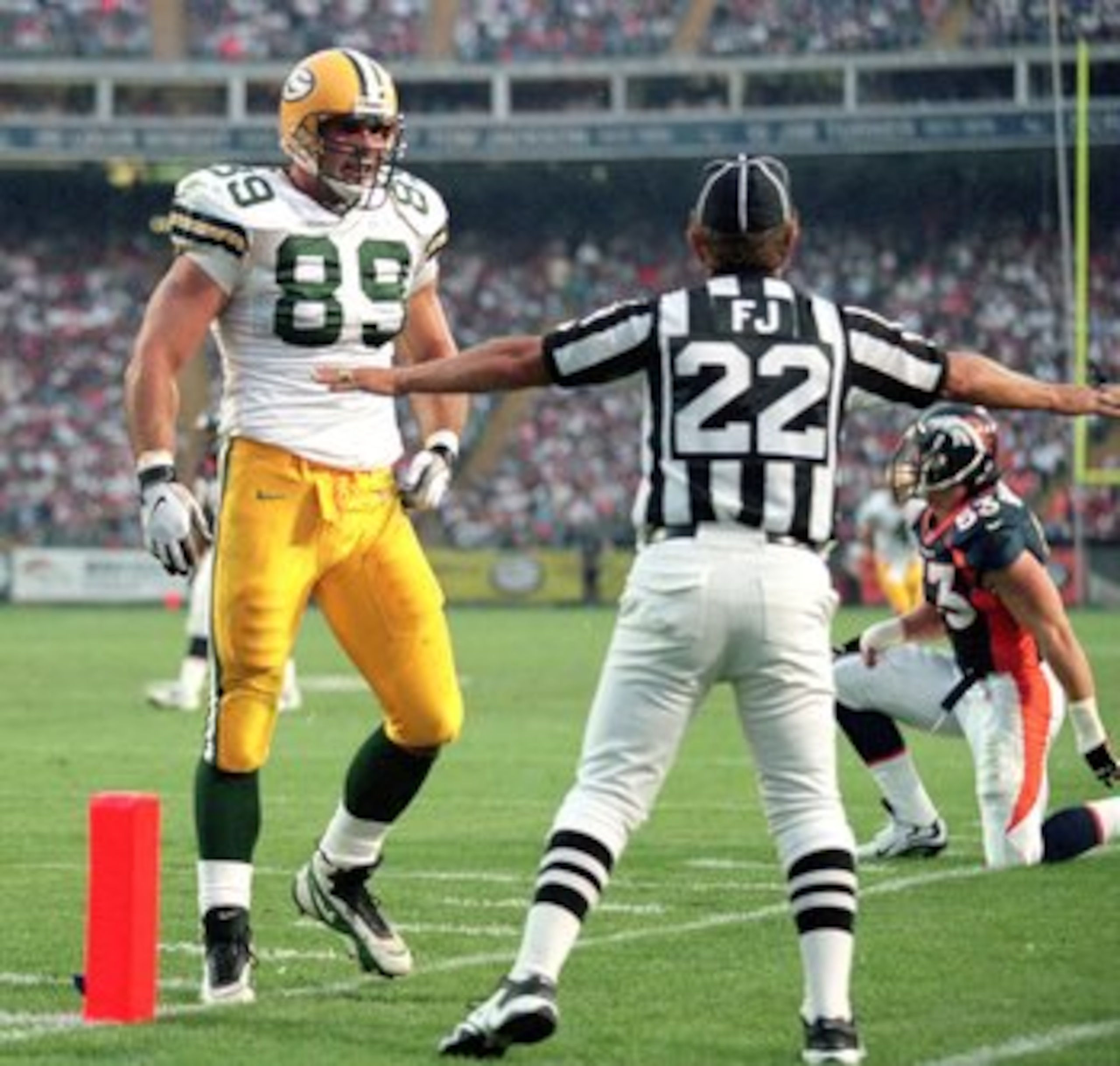 24 Aug 1998: Mark Chmura #89 of the Green Bay Packers walks towards an official during a game against the Denver Broncos at the Mile High Stadium in Denver, Colorado. The Broncos defeated the Packers 34-31.