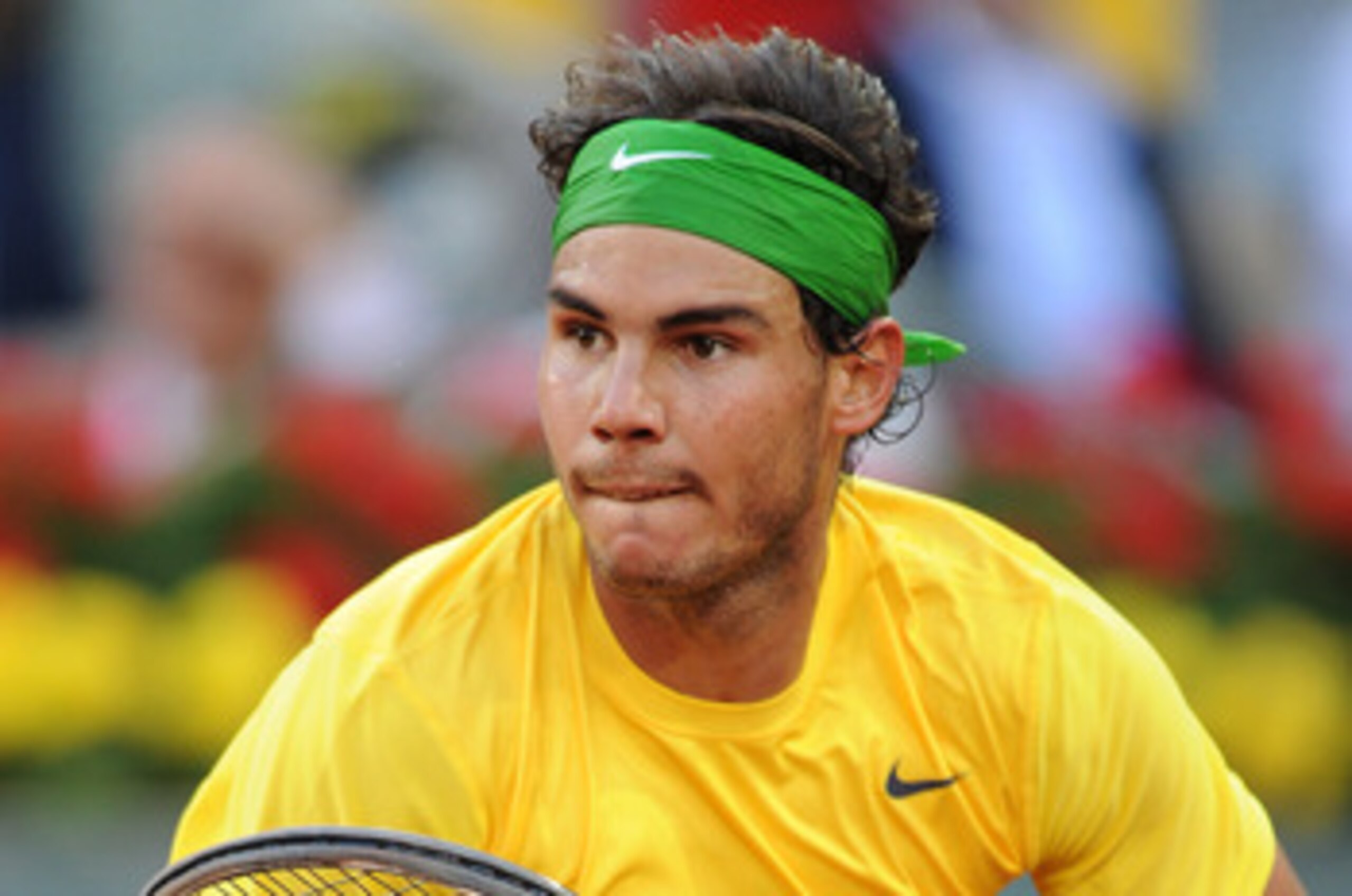 MADRID, SPAIN - MAY 08: Rafael Nadal of Spain runs for a ball in his final match against Novak Djokovic of Serbia on day eight of the Mutua Madrilena Madrid Open Tennis on May 8, 2011 in Madrid, Spain. Nadal lost his match in straight sets. (Photo by Ja MADRID, SPAIN - MAY 08: Rafael Nadal of Spain runs for a ball in his final match against Novak Djokovic of Serbia on day eight of the Mutua Madrilena Madrid Open Tennis on May 8, 2011 in Madrid, Spain. Nadal lost his match in straight sets. (Photo by Ja