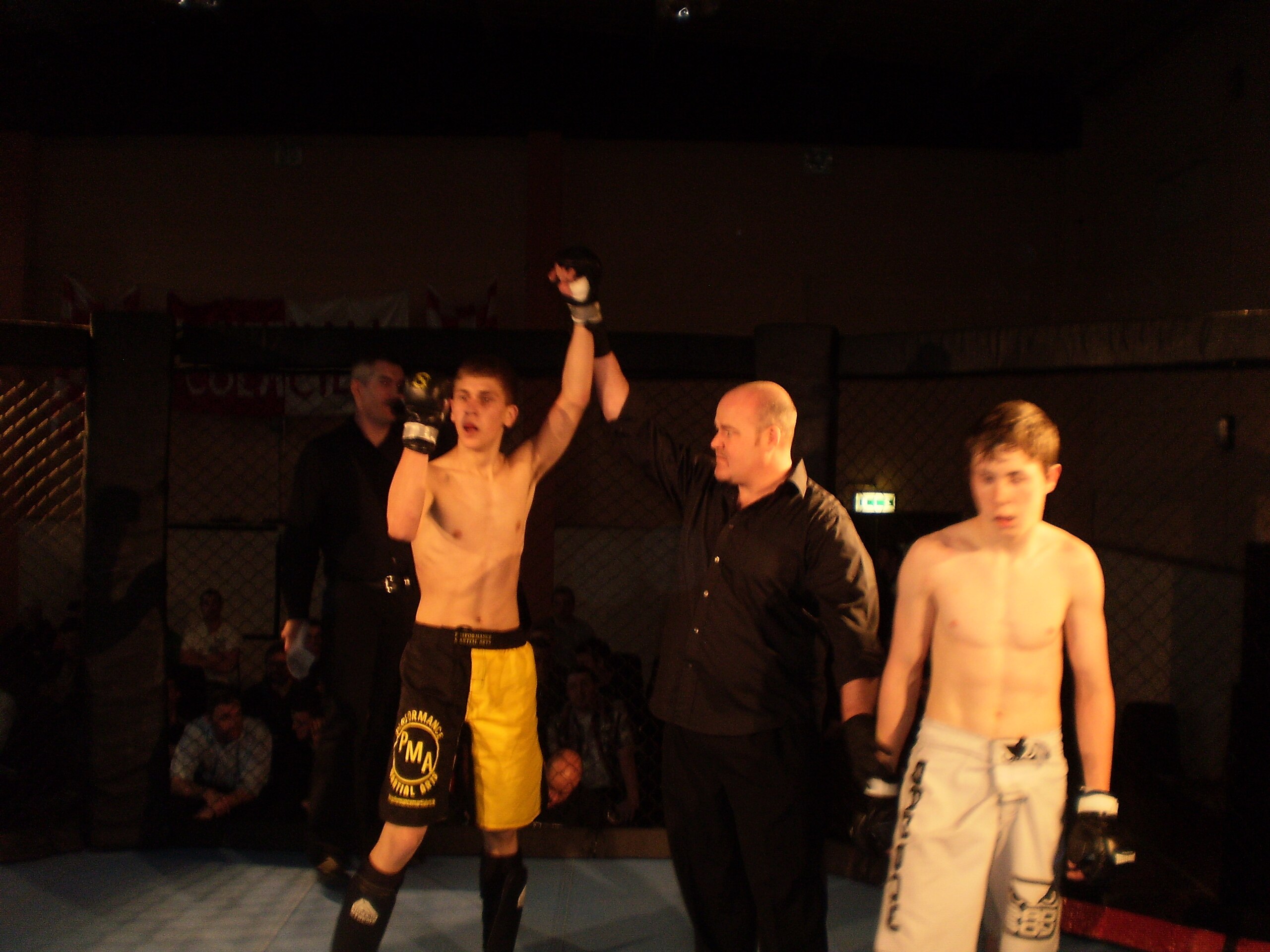 Chetari's arm raised in victory over McAuley